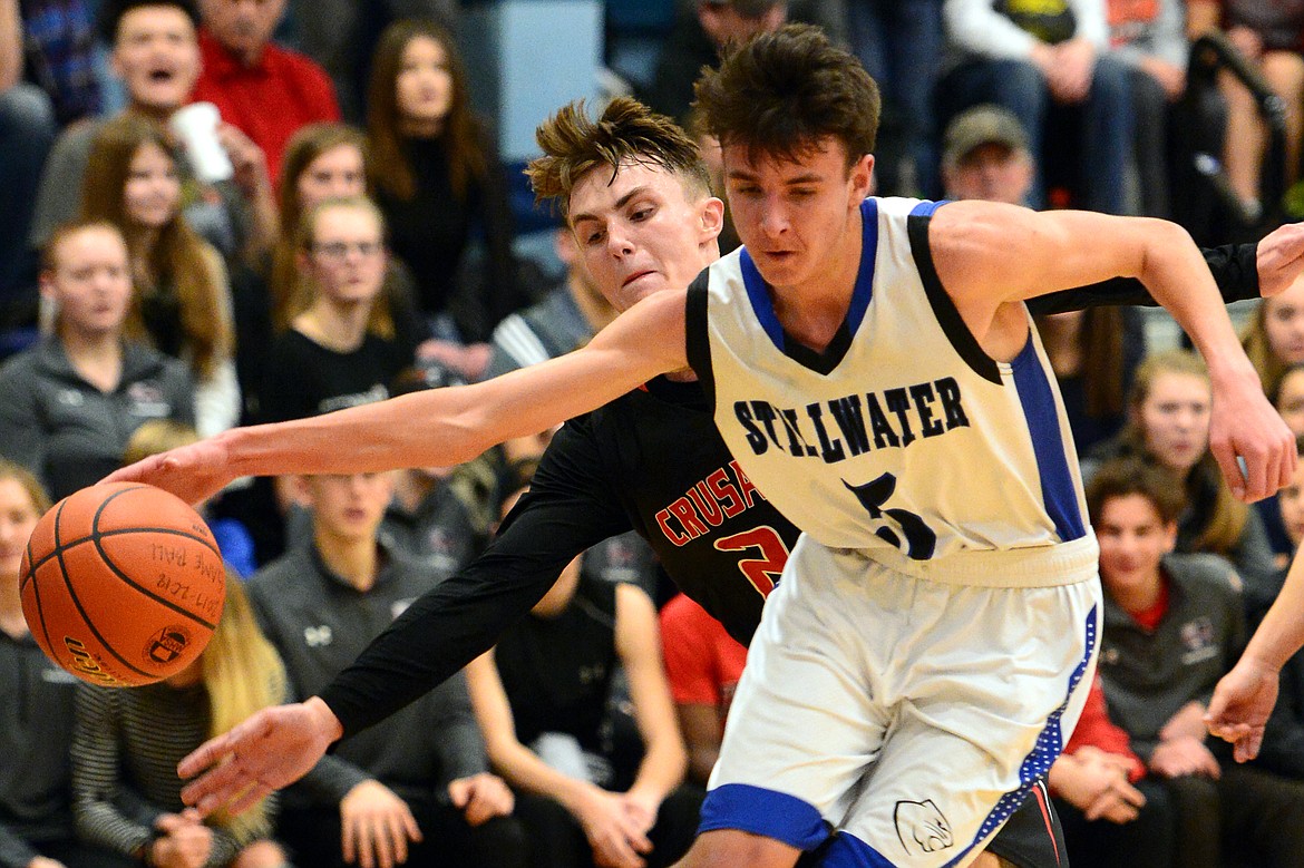 Flathead Valley Homeschool defender Spencer Burden knocks the ball loose from Stillwater Christian's Jorgen Lindborg. (Casey Kreider/Daily Inter Lake)