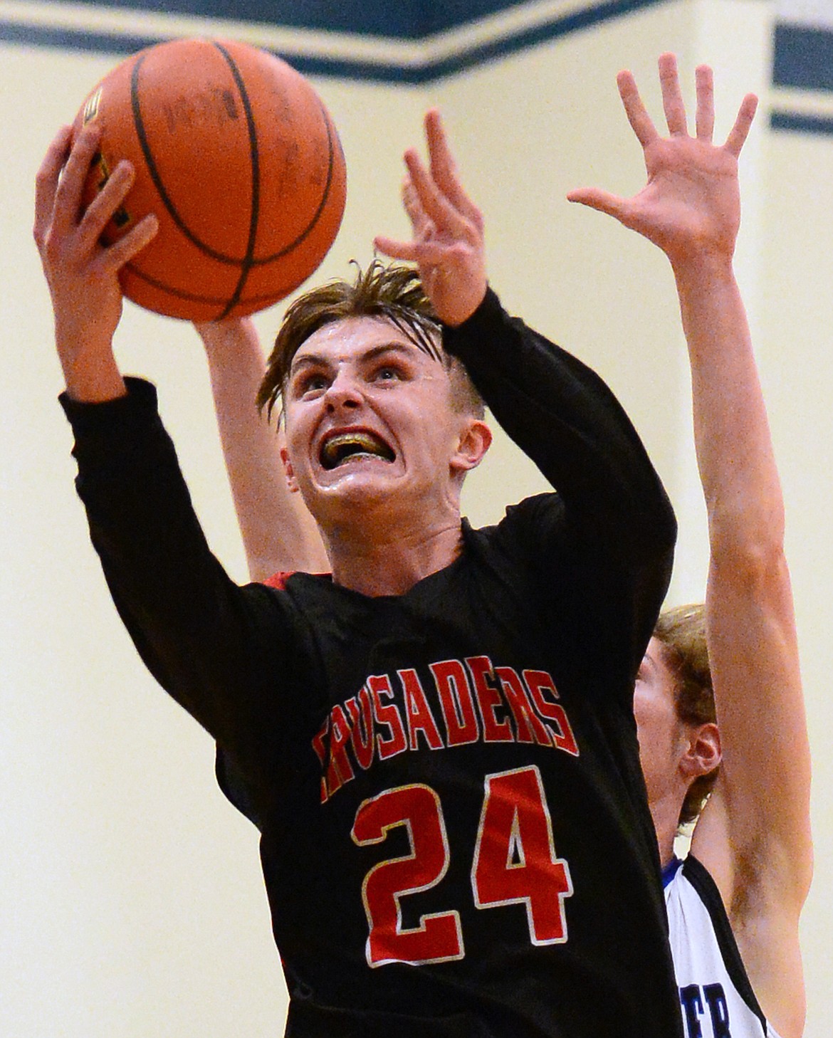 Flathead Valley Homeschool's Spencer Burden drives to the hoop for two points against Stillwater Christian. (Casey Kreider/Daily Inter Lake)