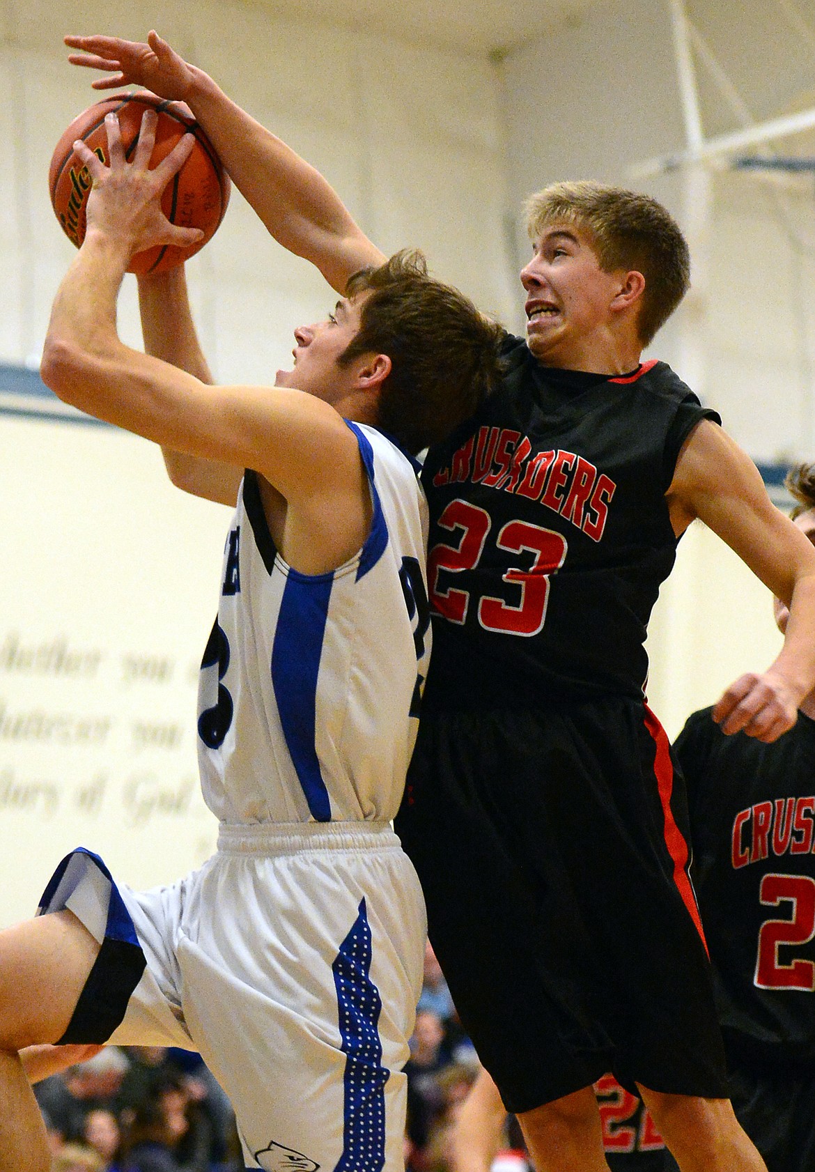 Stillwater Christian's Jared Fetveit has his shot blocked by Flathead Valley Homeschool's Jordan Wininger. (Casey Kreider/Daily Inter Lake)