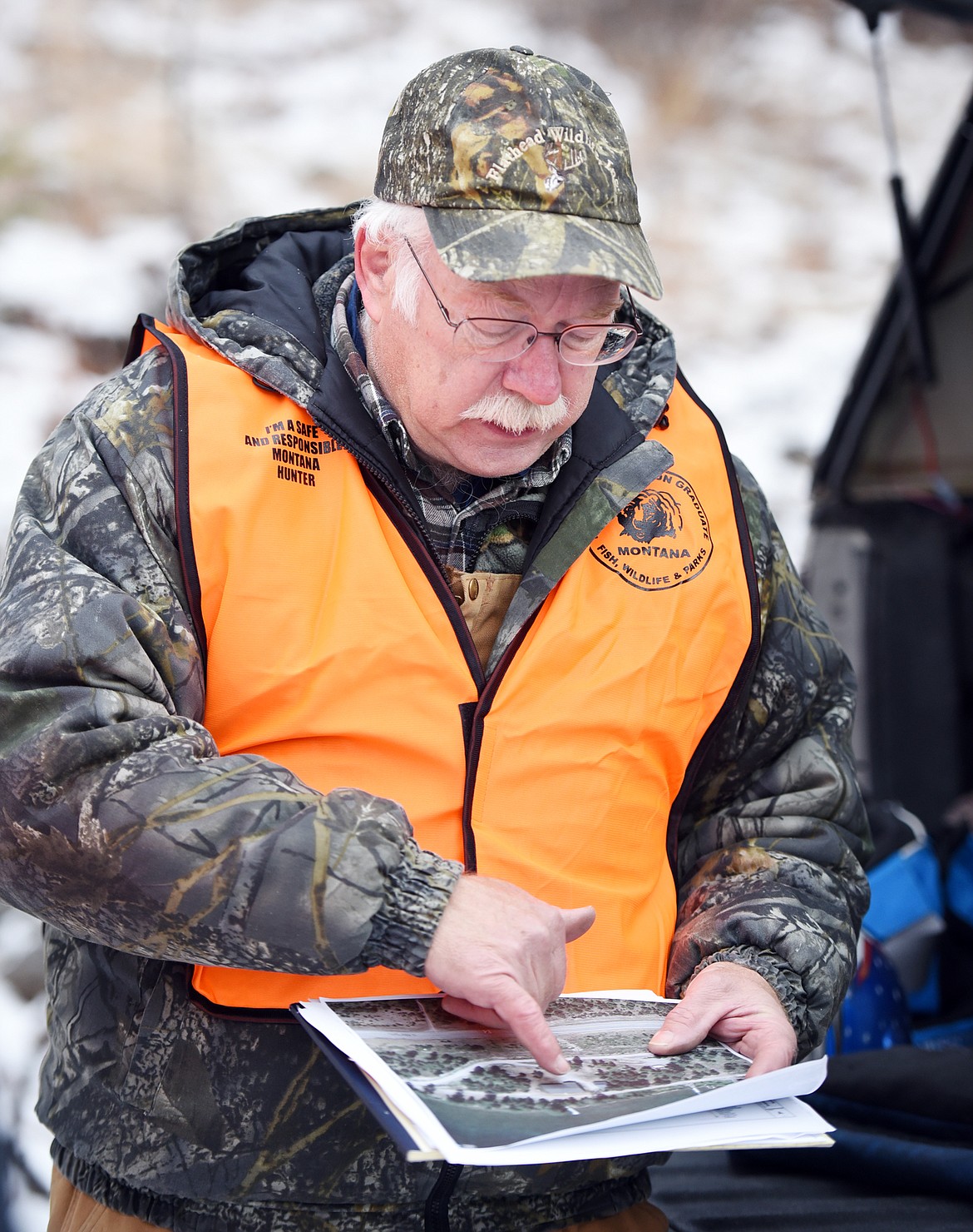 Jim Vashro, president of Flathead Wildlife, Inc., explains the public access lane boundaries at a cleanup day with Fish, Wildlife and Parks on Friday morning, December 15, at McGregor Lake.(Brenda Ahearn/Daily Inter Lake)