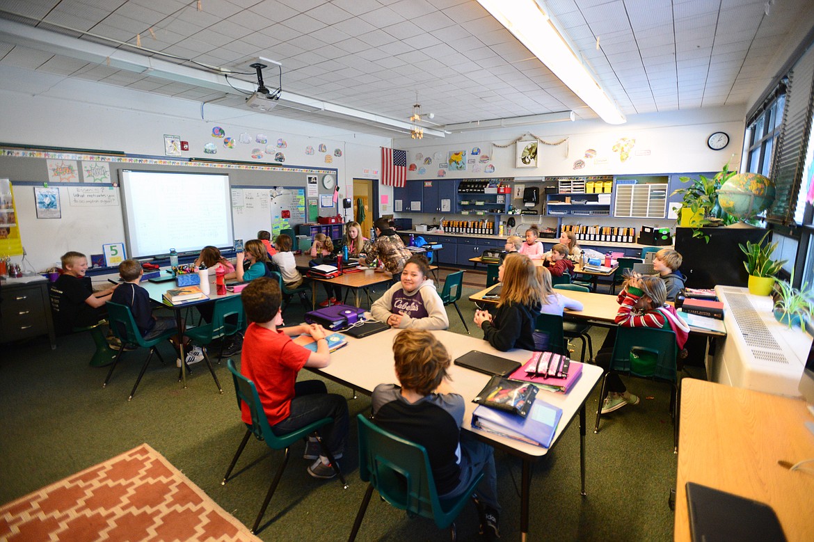 Breaking the class up into small groups is one of the teaching strategies in Mrs. LaCasse&#146;s fifth-grade classroom at Elrod Elementary School. (Casey Kreider/Daily Inter Lake)