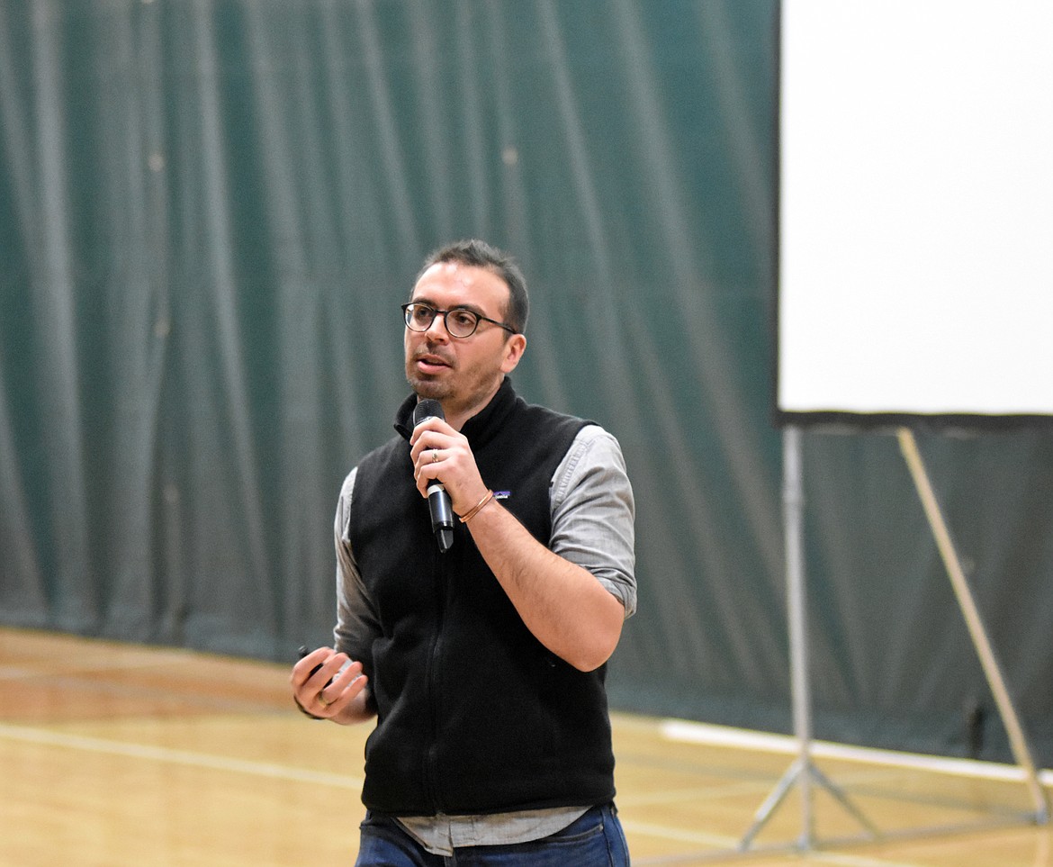 Photographer Peter DiCampo speaks about his Everyday Africa project with students in the Whitefish High School gym last week. (Heidi Desch/Whitefish Pilot)