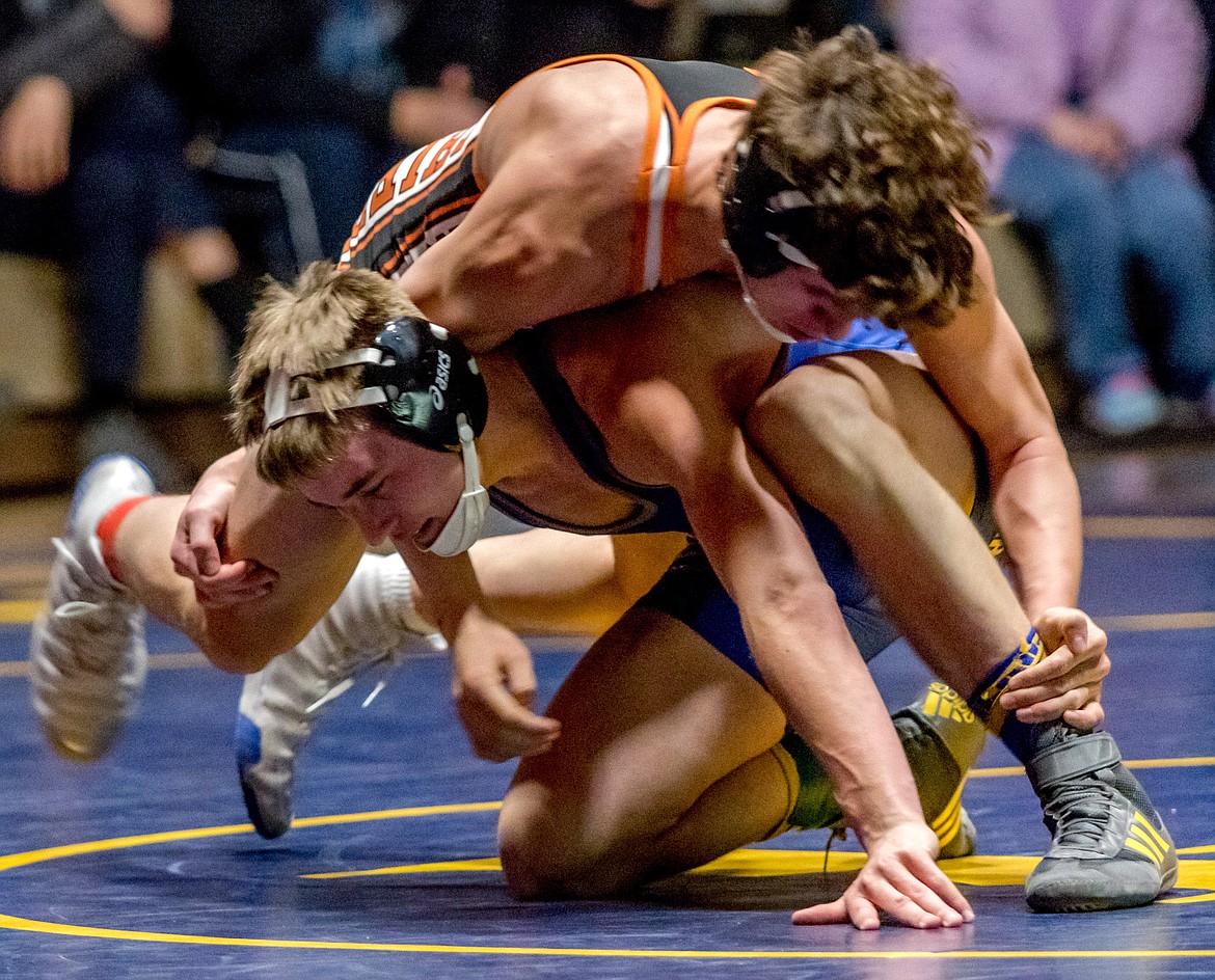 Libby Logger Dawson Young looks to finish a takedown against Ronan&#146;s Seth Cheff Tuesday at Libby High School. (John Blodgett/The Western News)