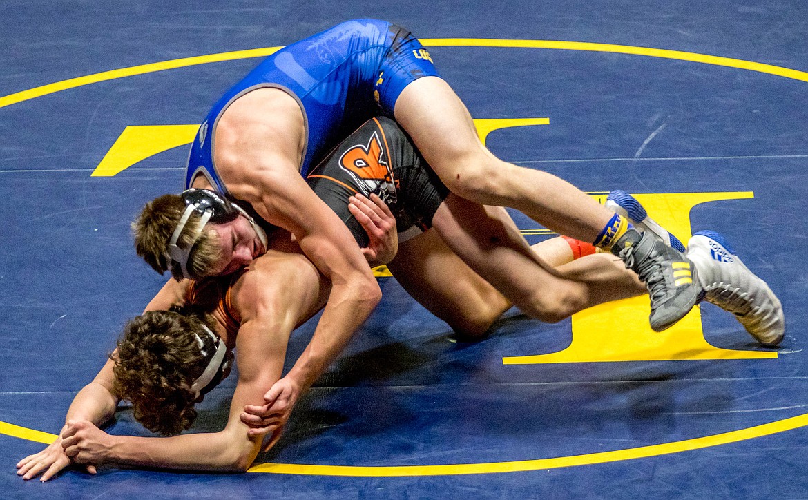 Libby&#146;s Dawson Young wrestles with Ronan&#146;s Seth Cheff Tuesday in Libby. (John Blodgett/The Western News)
