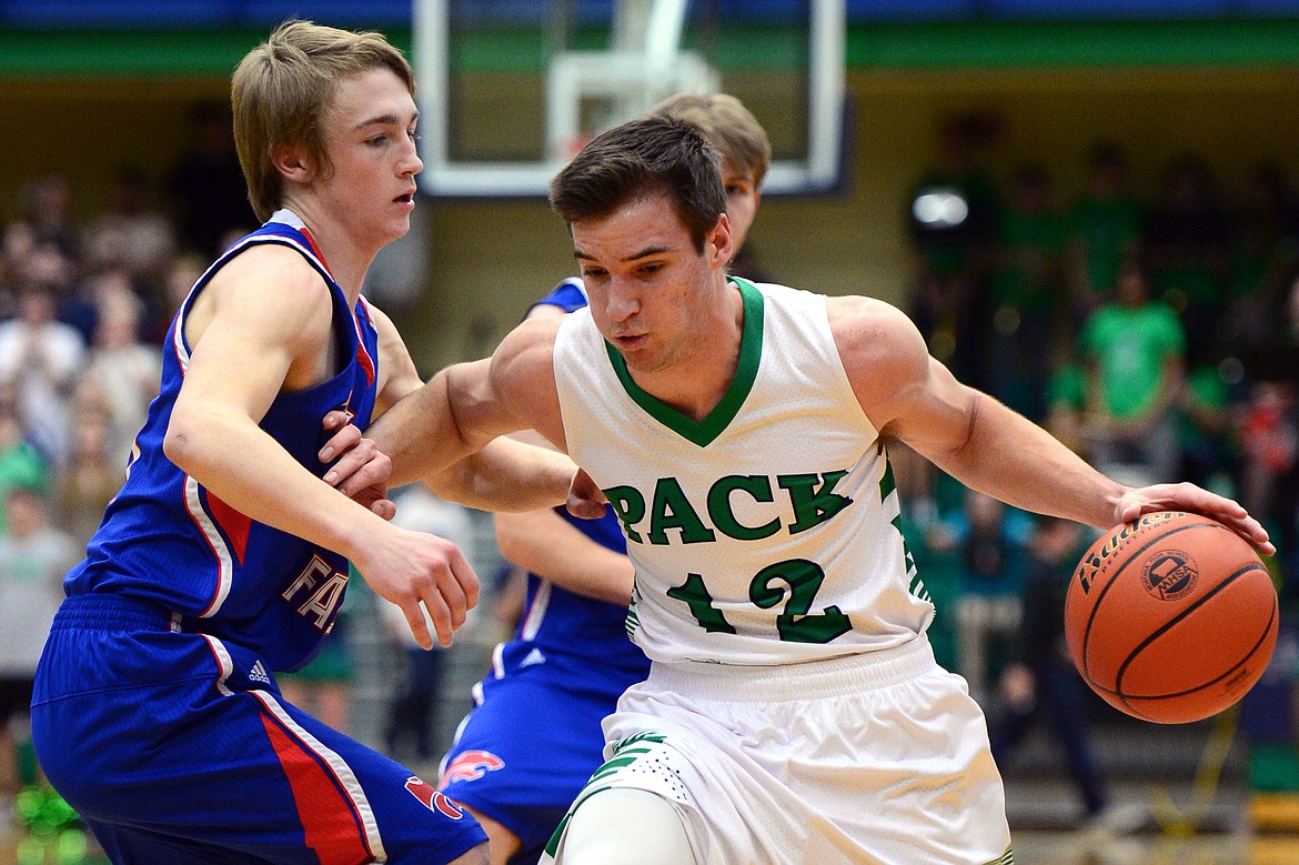 Glacier&#146;s Kody Jarvis, right, looks for room with Columbia Falls&#146; Logan Bechtel defending. (Casey Kreider/Daily Inter Lake)