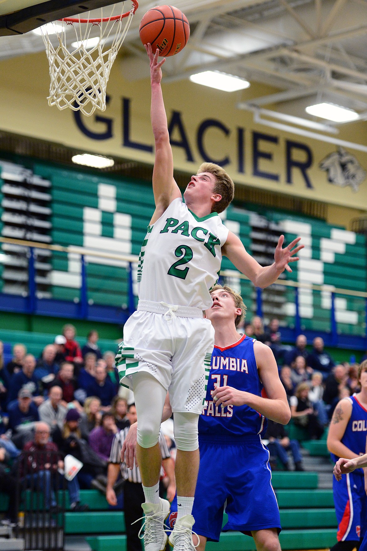 Glacier&#146;s Caden Harkins drives to the hoop in front of Columbia Falls defender Matthew Morrison. (Casey Kreider/Daily Inter Lake)