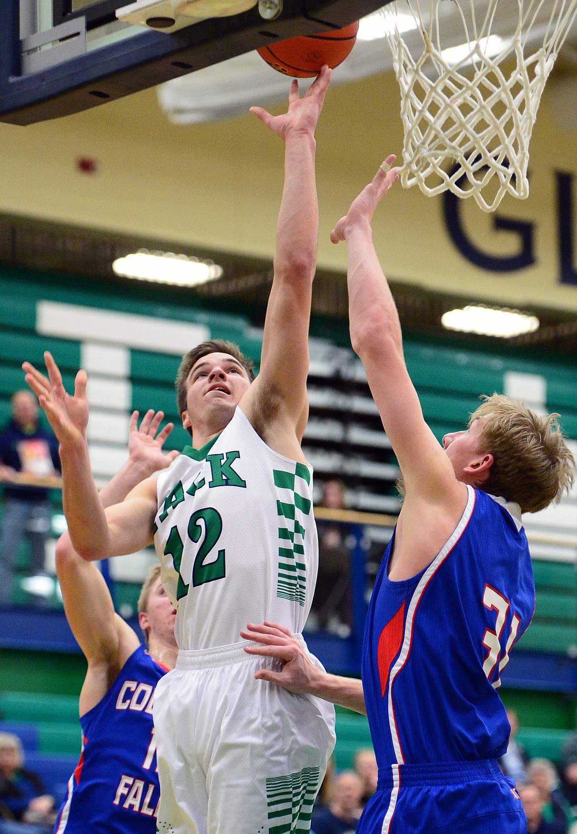 Glacier&#146;s Kody Jarvis drives to the hoop with Columbia Falls&#146; Matthew Morrison (31) defending. (Casey Kreider/Daily Inter Lake)