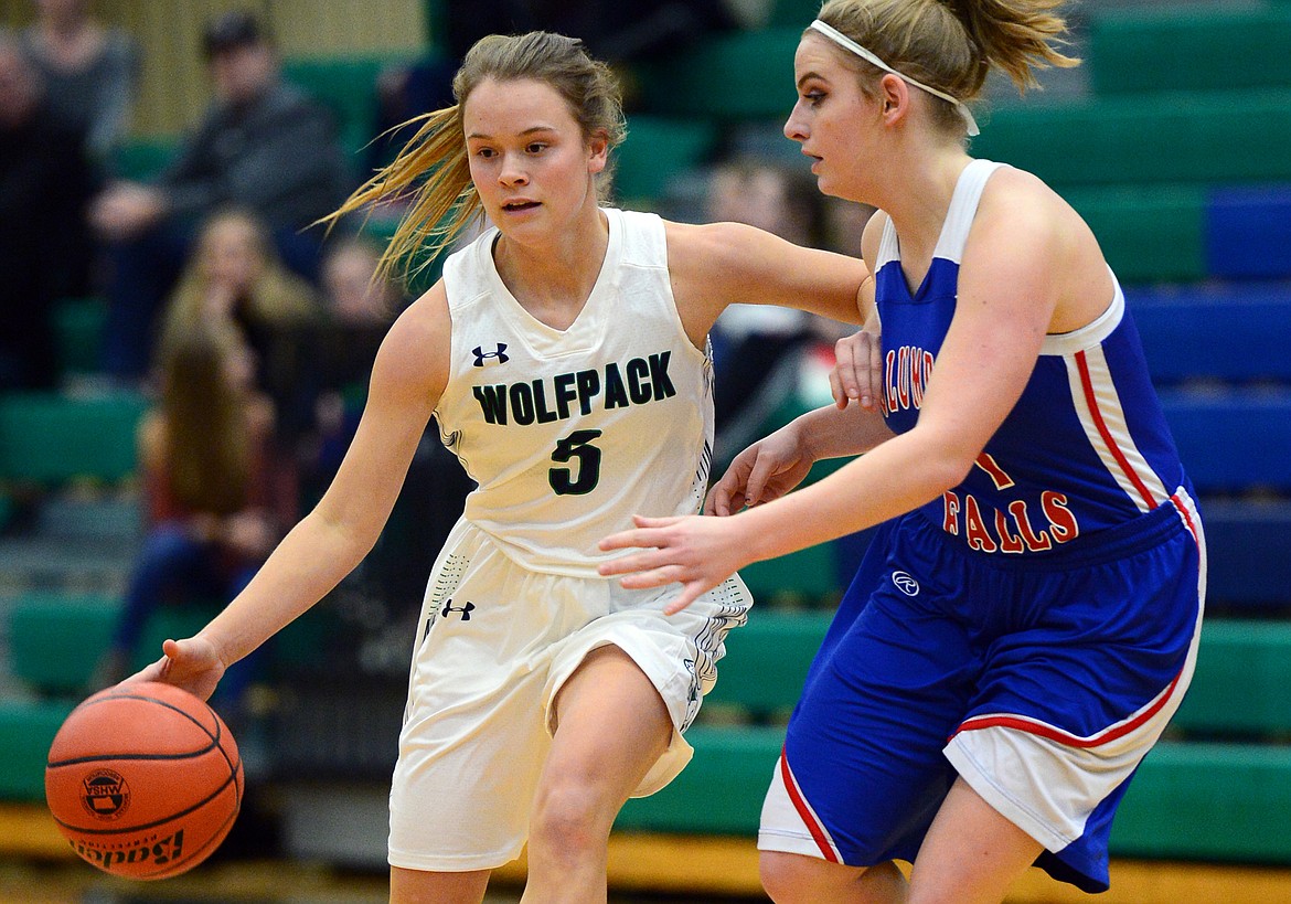 Glacier&#146;s Cadie Williams dribbles the ball upcourt with Columbia Falls&#146; Savannah Ellis defending. (Casey Kreider/Daily Inter Lake)