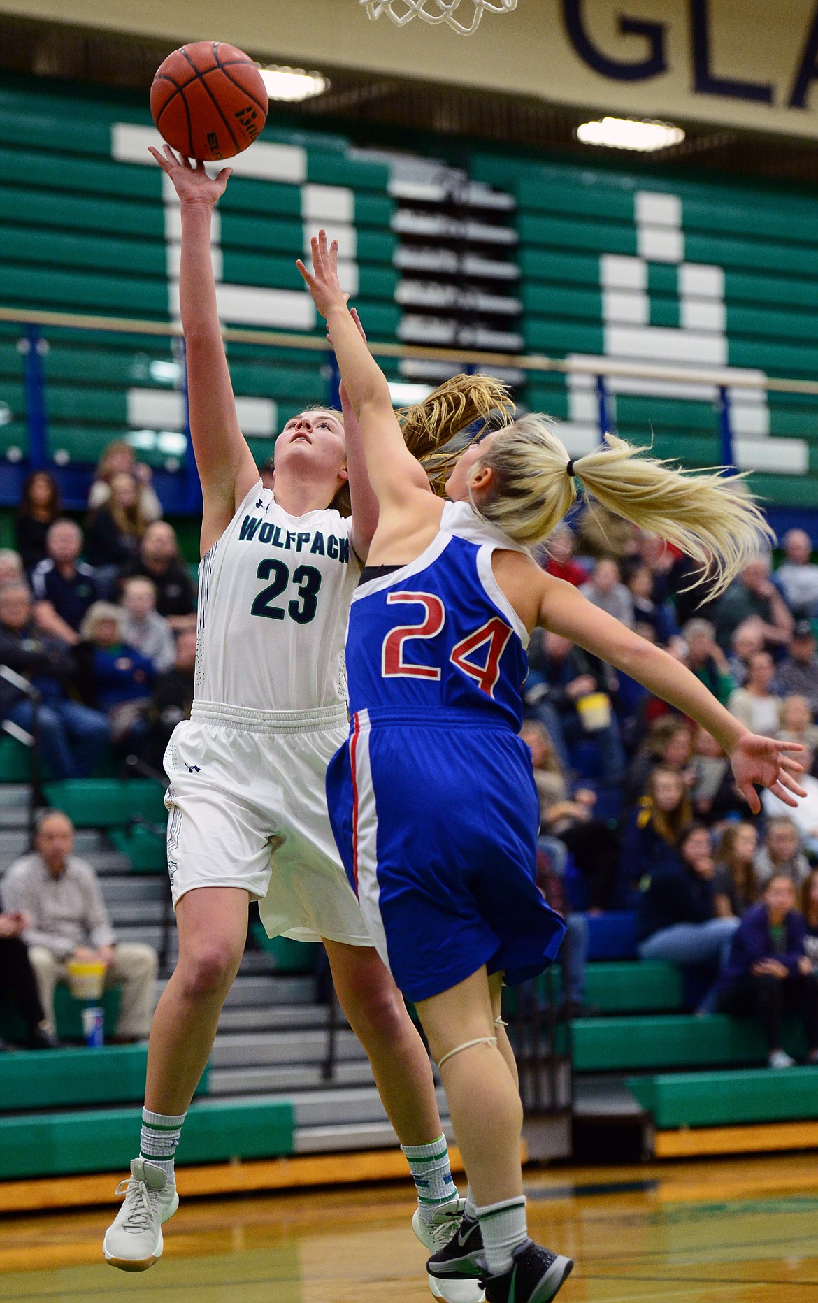 Glacier&#146;s Anna Schrade goes to the basket against Columbia Falls defender Diane Vasquez. (Casey Kreider/Daily Inter Lake)