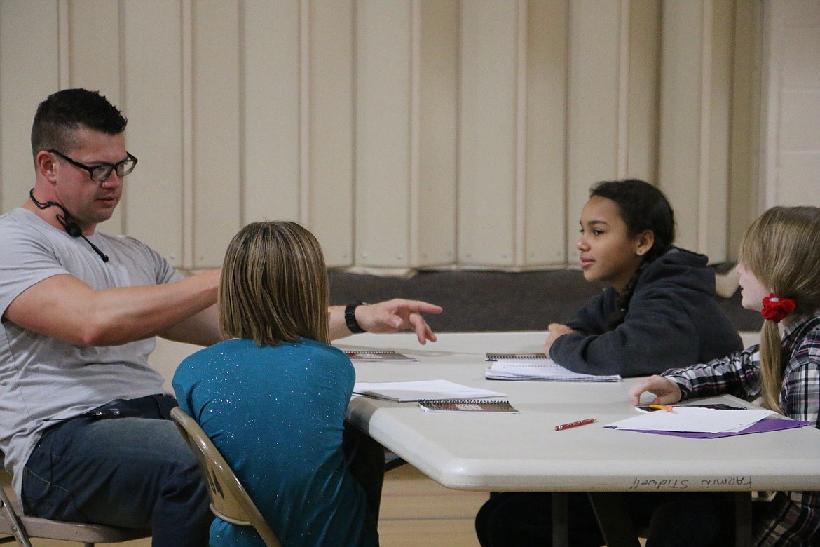 (Photo by MARY MALONE)
John Williams, president and founder of Life that Counts, Inc., talks to some Farmin-Stidwell Elementary students on Friday as he facilitated &#147;hero training&#148; to kick of a 21-day compassion challenge in the school.