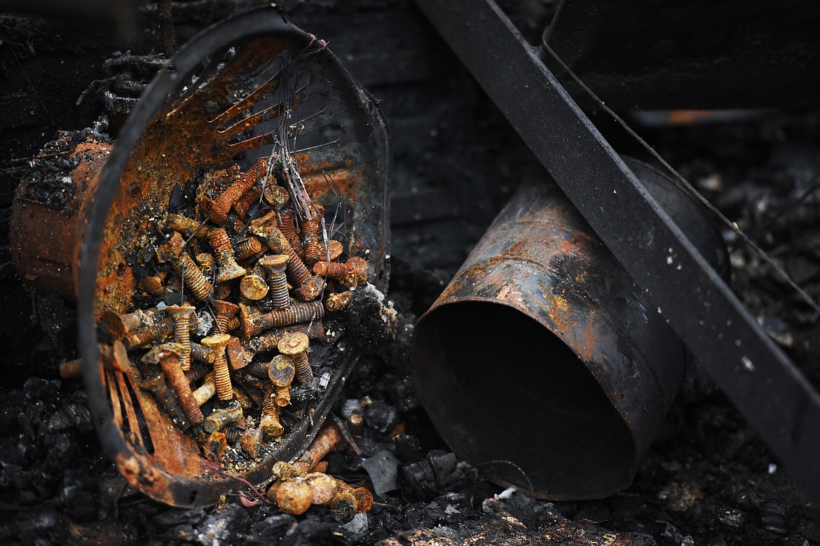 Details of the remains of a barn fire near Echo Lake that resulted in an estimated half a million dollars worth of loss.(Brenda Ahearn/Daily Inter Lake)