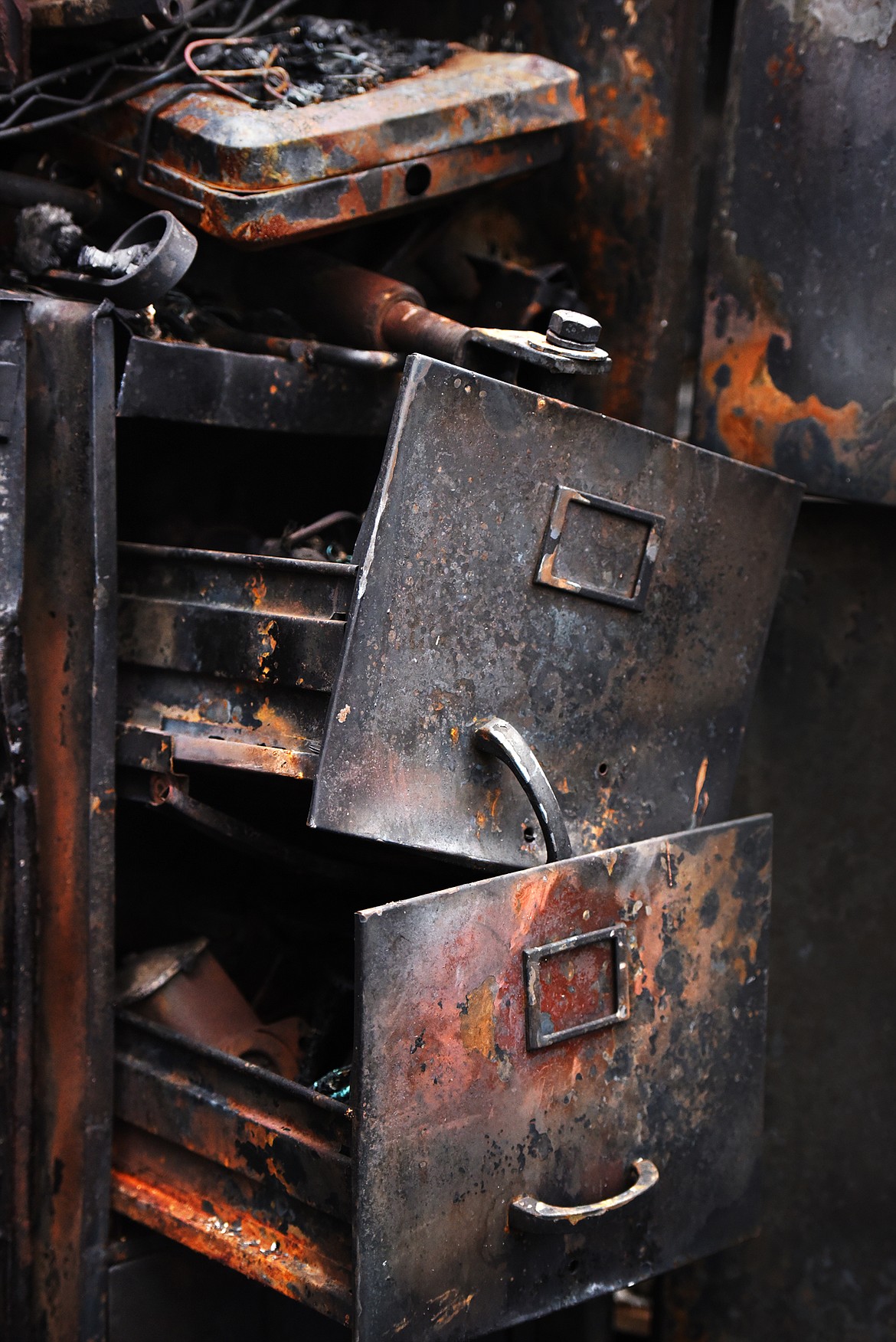 Details of the remains of a barn fire near Echo Lake that resulted in an estimated half a million dollars worth of loss.(Brenda Ahearn/Daily Inter Lake)