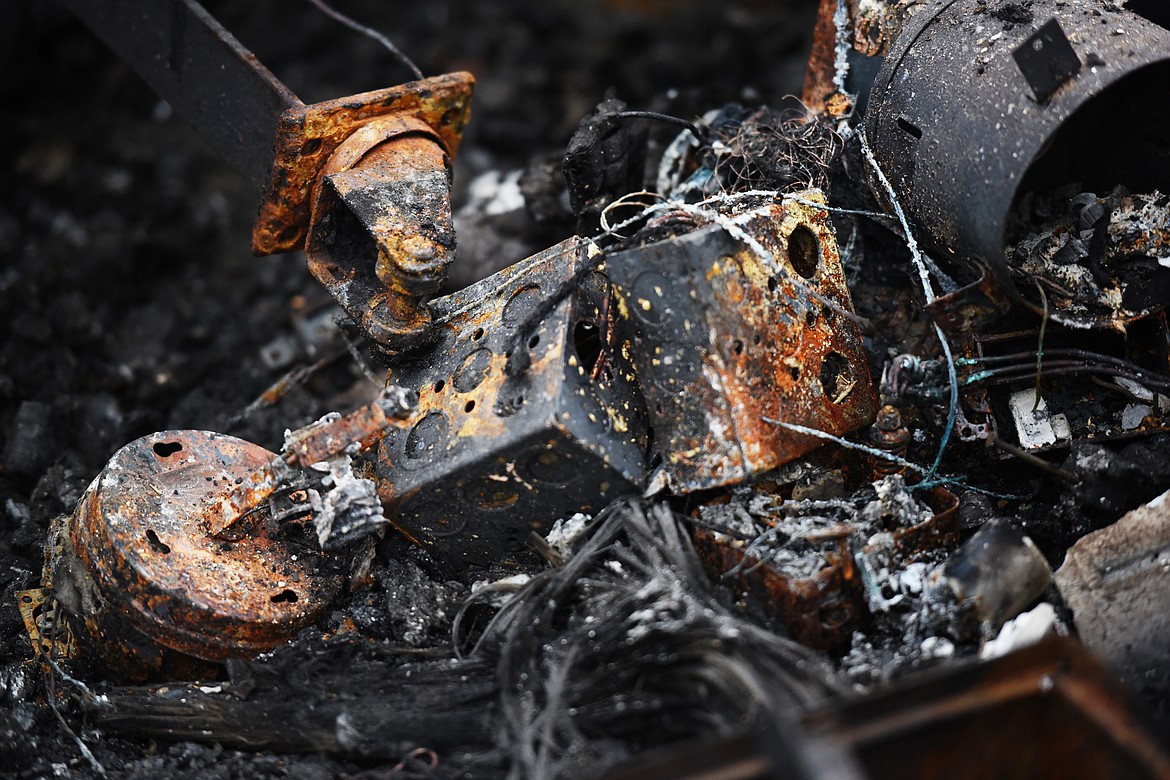 Details of the remains of a barn fire near Echo Lake that resulted in an estimated half a million dollars worth of loss.(Brenda Ahearn/Daily Inter Lake)