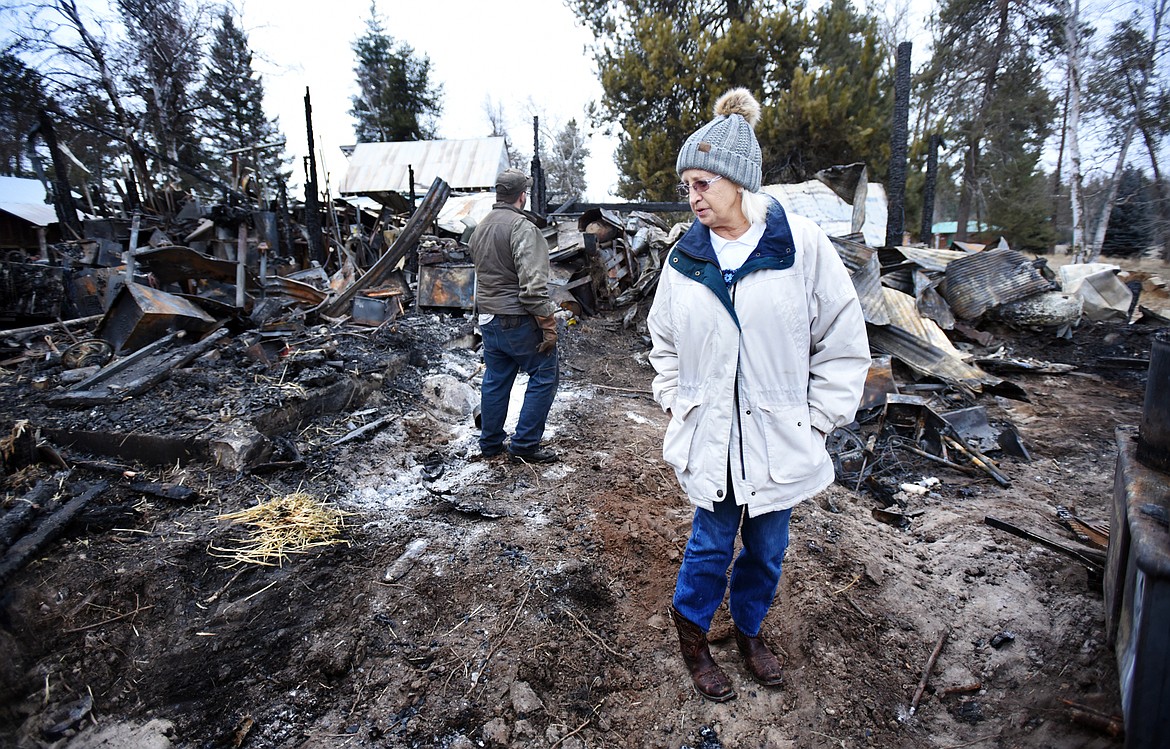 Mavis Gordon takes in the scene of the barn fire at her son&#146;s home near Echo Lake on Monday, December 11. Three generations of tools and equipment were destroyed in the fire causing an estimated half million dollars worth of damage.(Brenda Ahearn/Daily Inter Lake)