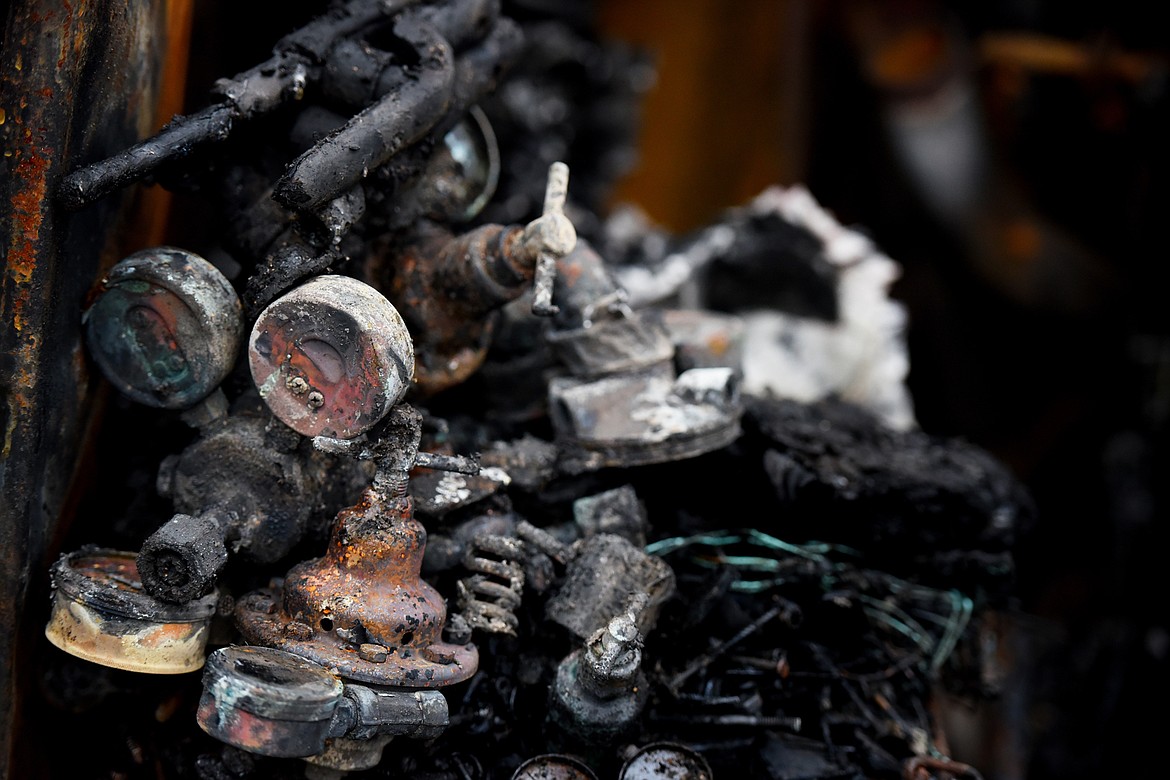 Details of the remains of a barn fire near Echo Lake that resulted in an estimated half a million dollars worth of loss.(Brenda Ahearn/Daily Inter Lake)