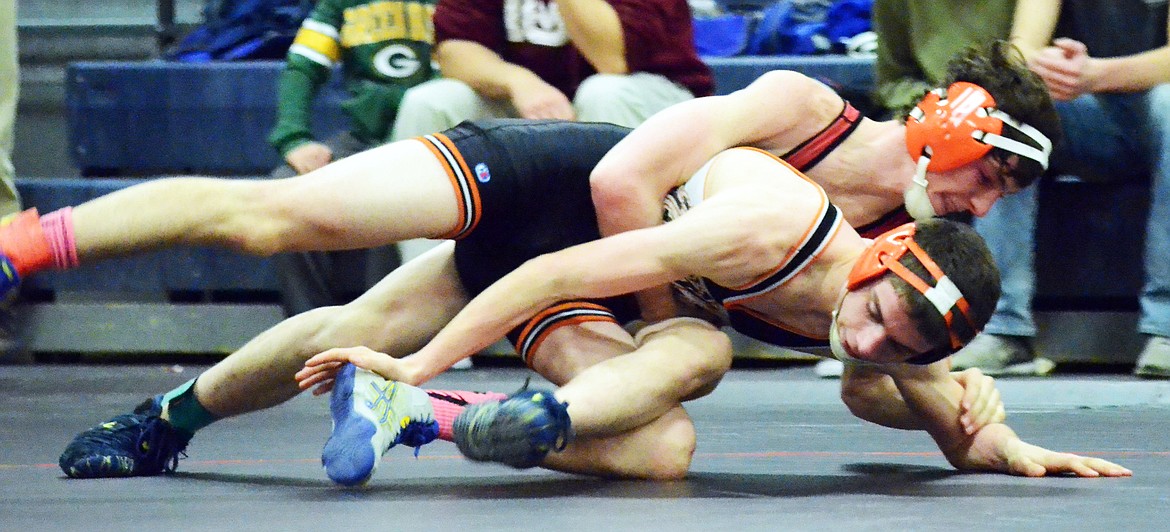 Daniel Uli  of the Savage Horsemen gets a hold on his Eureka opponent at Plains ahead of the Bob Kinney Tournament. (Erin Jusseaume/ Clark Fork Valley Press)