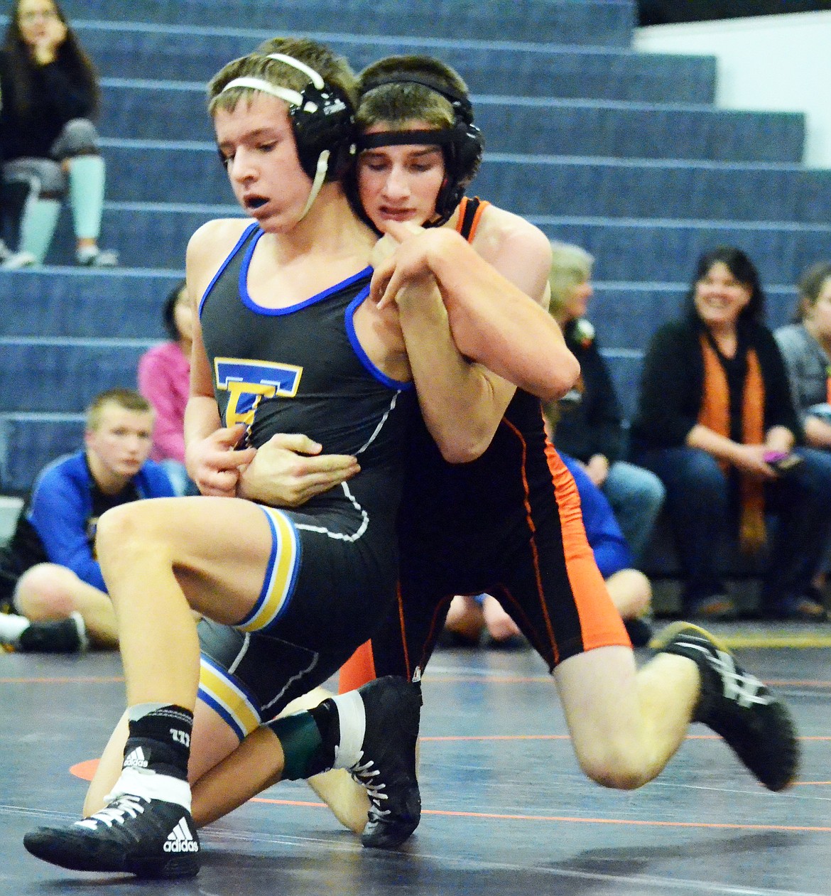 Conrad Vanderwall of the Savage Horsemen works to get a pin on his Thompson Falls opponent at the Plains Quad.