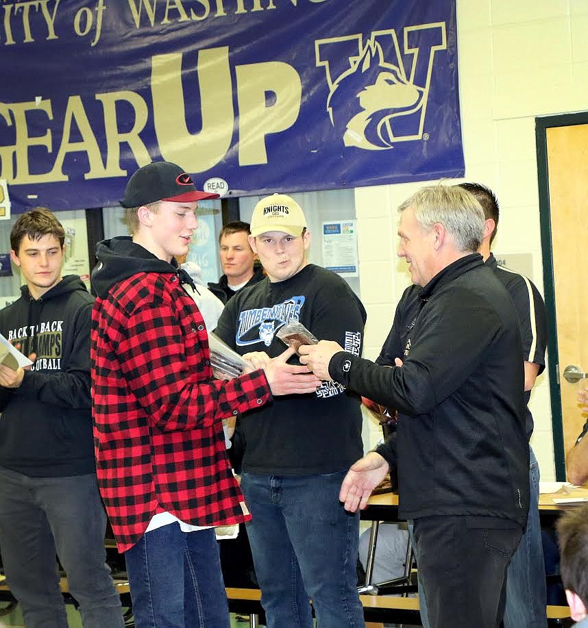 Pete Christensen photo - Coach Wiley Allred hands senior Corbin Christensen one of several awards he was recognized for during the 2017-18 season. Christensen was named to the SCAC All-League First-Team Offensive unit, voted First-Team Return Specialist and All-League MVP, and named to the All-League Second-Team Defensive squad.