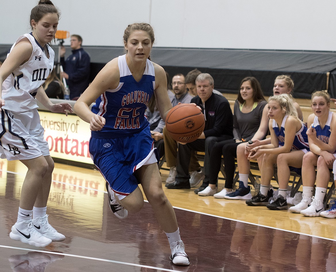 Hannah Schweikert drives to the hoop against Dillon. (Jeremy Weber photo)