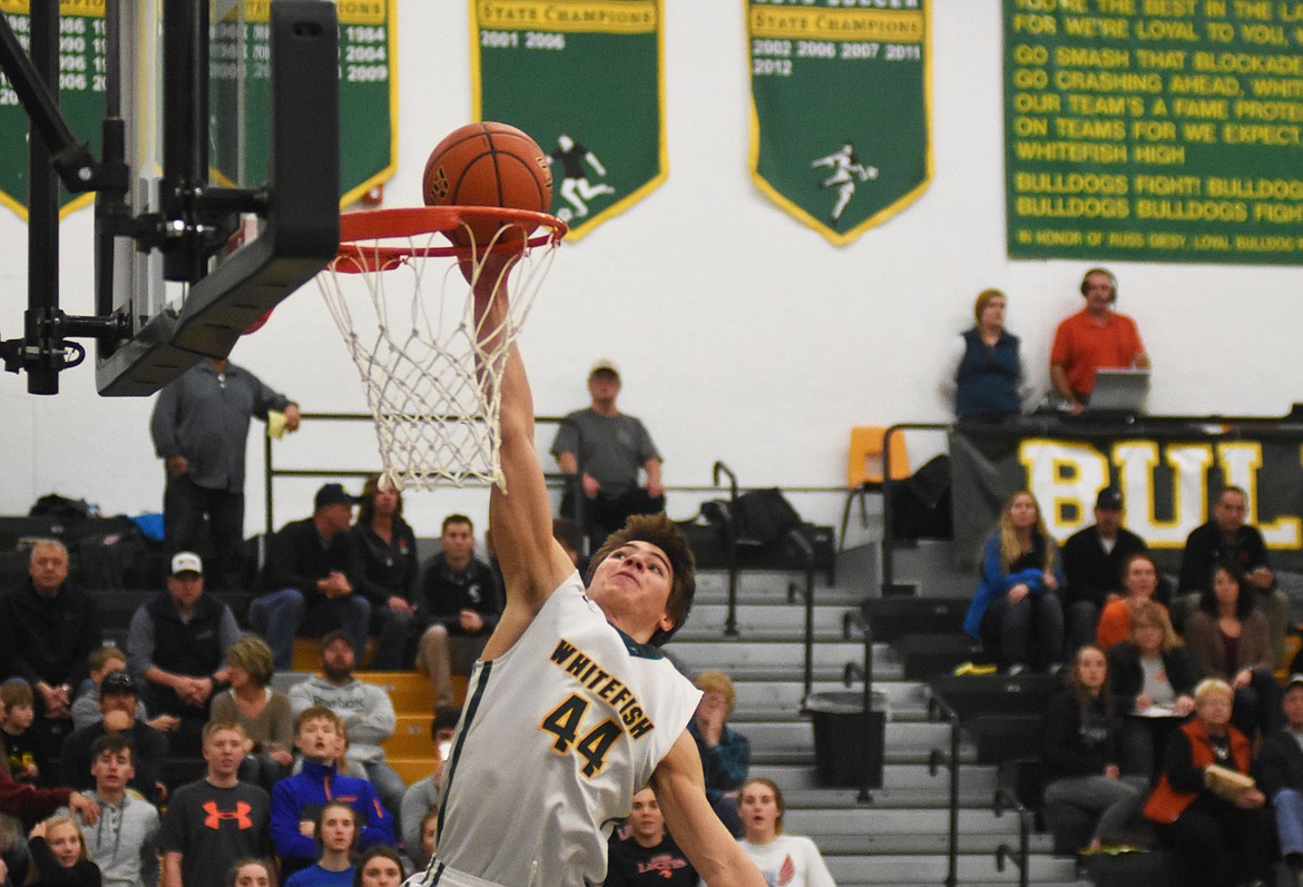 Lee Walburn rises up for the slam in a blowout win over Eureka last Tuesday. (Daniel McKay photos/Whitefish Pilot)