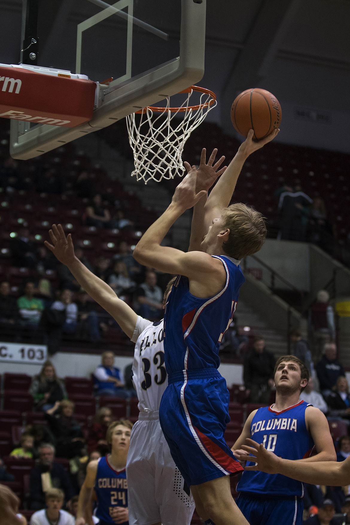 Matthew Morrison goes up for a basket against the Dillon defense. (Jeremy Weber photo)