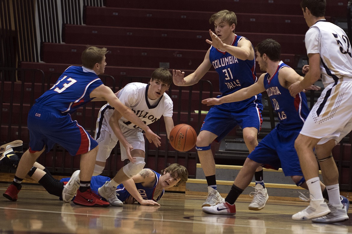 The Wildcat defense knocks the ball away from a Dillon dribbler. (Jeremy Weber photo)