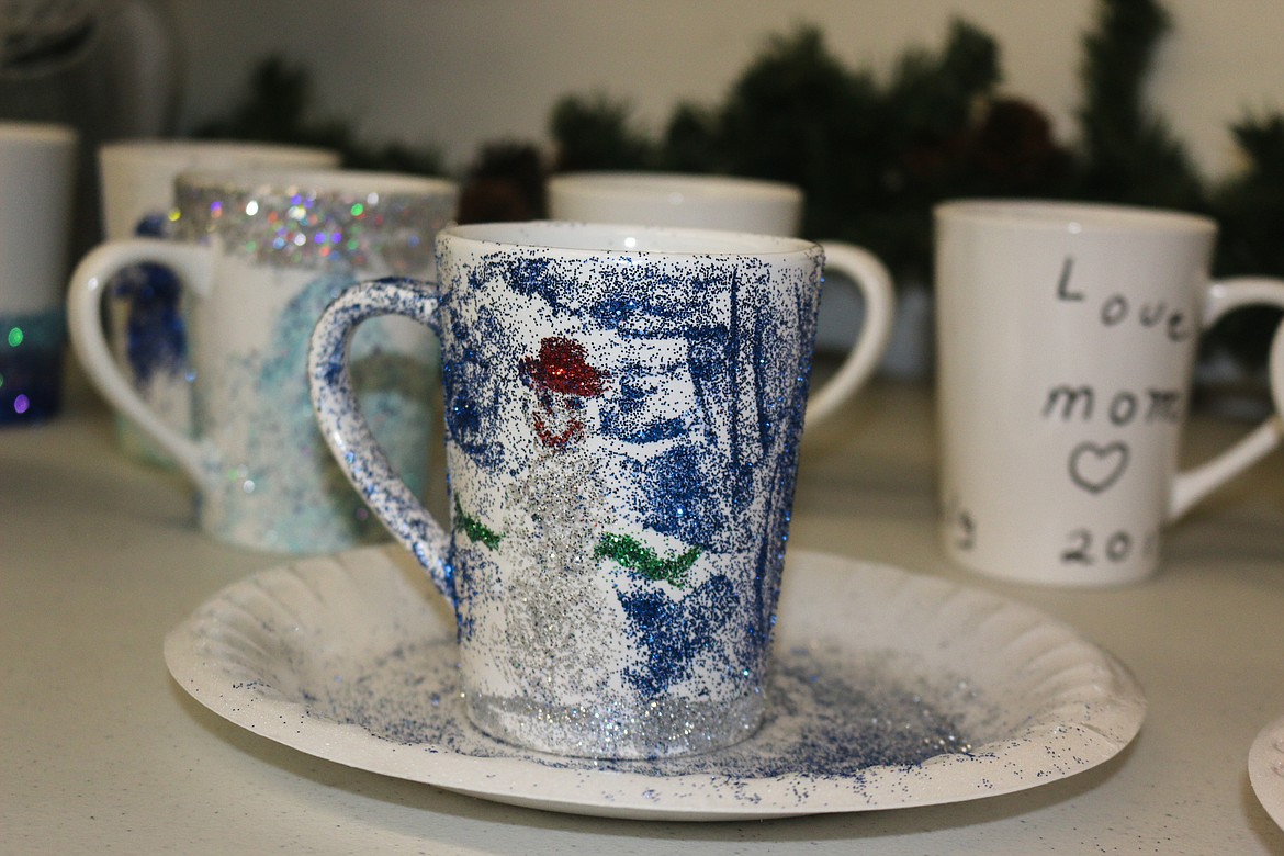 Photo by Mandi Bateman
Hand painted and glittered mugs mugs drying on the table.