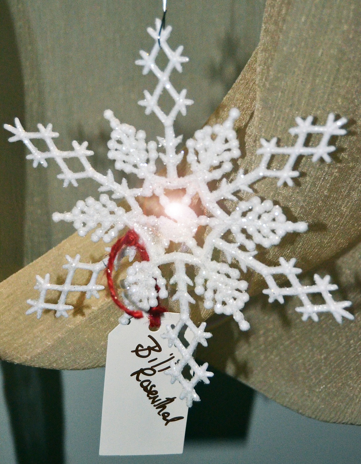 A snowflake ornament placed on the remembrance tree for a loved one. (Erin Jusseaume/ Clark Fork Valley Press)