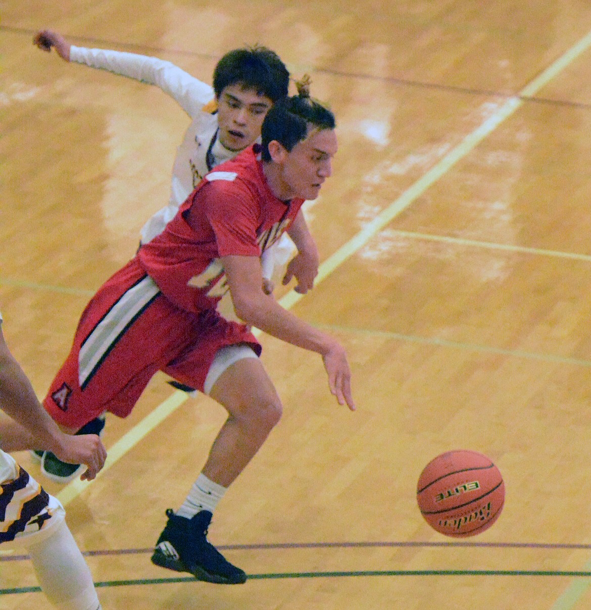 ARLEE GUARD Greg Whitesell drives to the basket in the Warriors' first game of the Native American Classic against Rocky Boy Friday night at Joe McDonald Gym at Salish Kootenai College. (Jason Blasco/Lake County Leader)