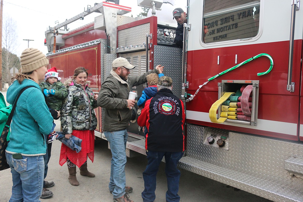 Photo by Mandi Bateman
All ages clambered aboard the fire trucks for rides around Naples.