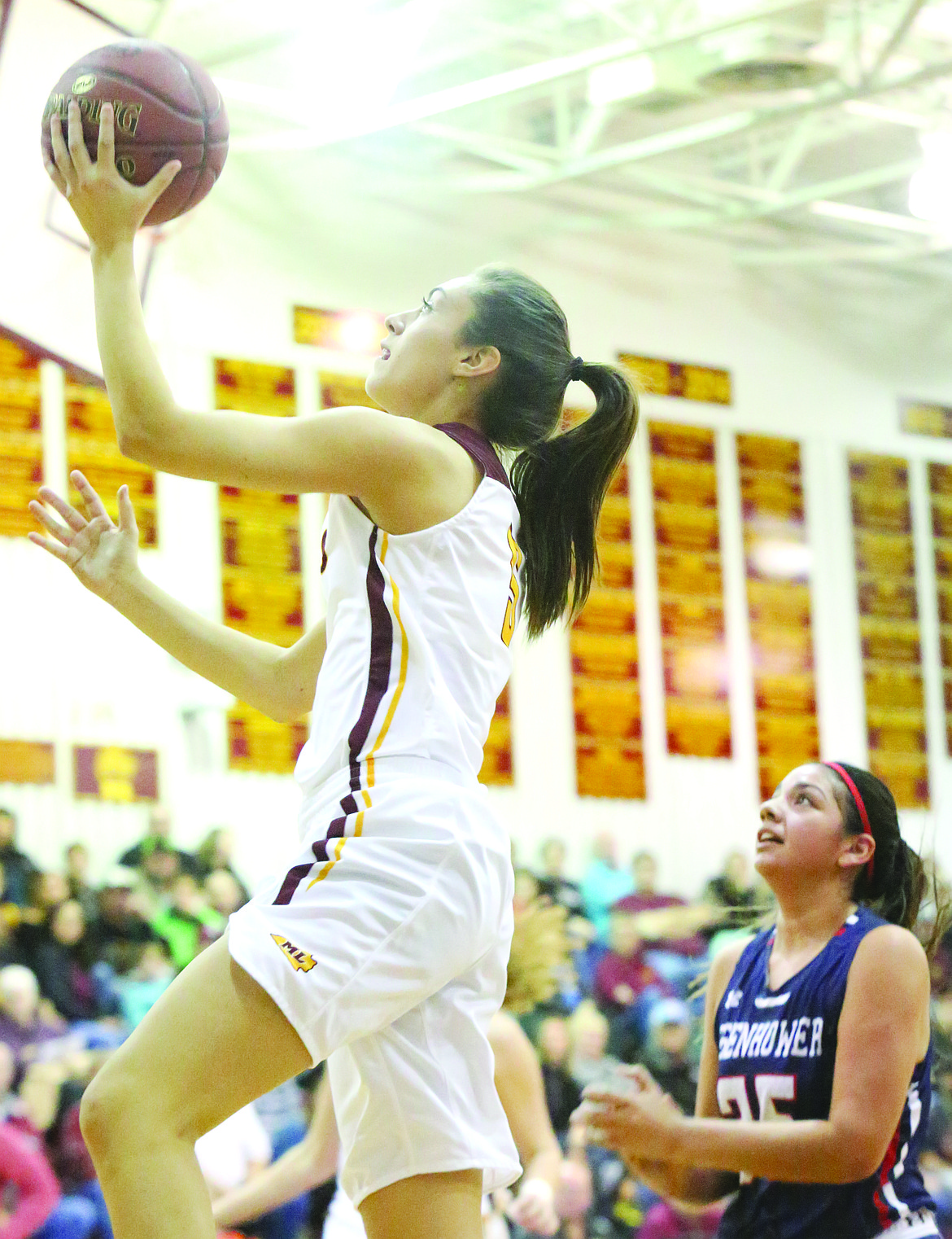 Connor Vanderweyst/Columbia Basin Herald
Moses Lake guard Jamie Loera scores two of her nine points against Eisenhower.