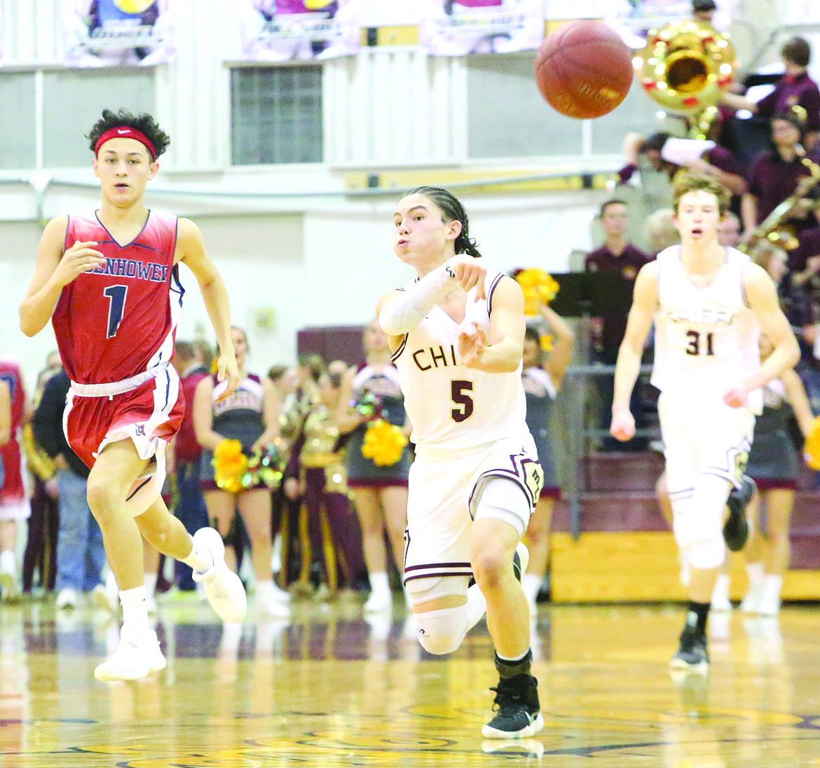 Connor Vanderweyst/Columbia Basin Herald
Moses Lake point guard Cory Kunjara (5) passes the ball ahead against Eisenhower.