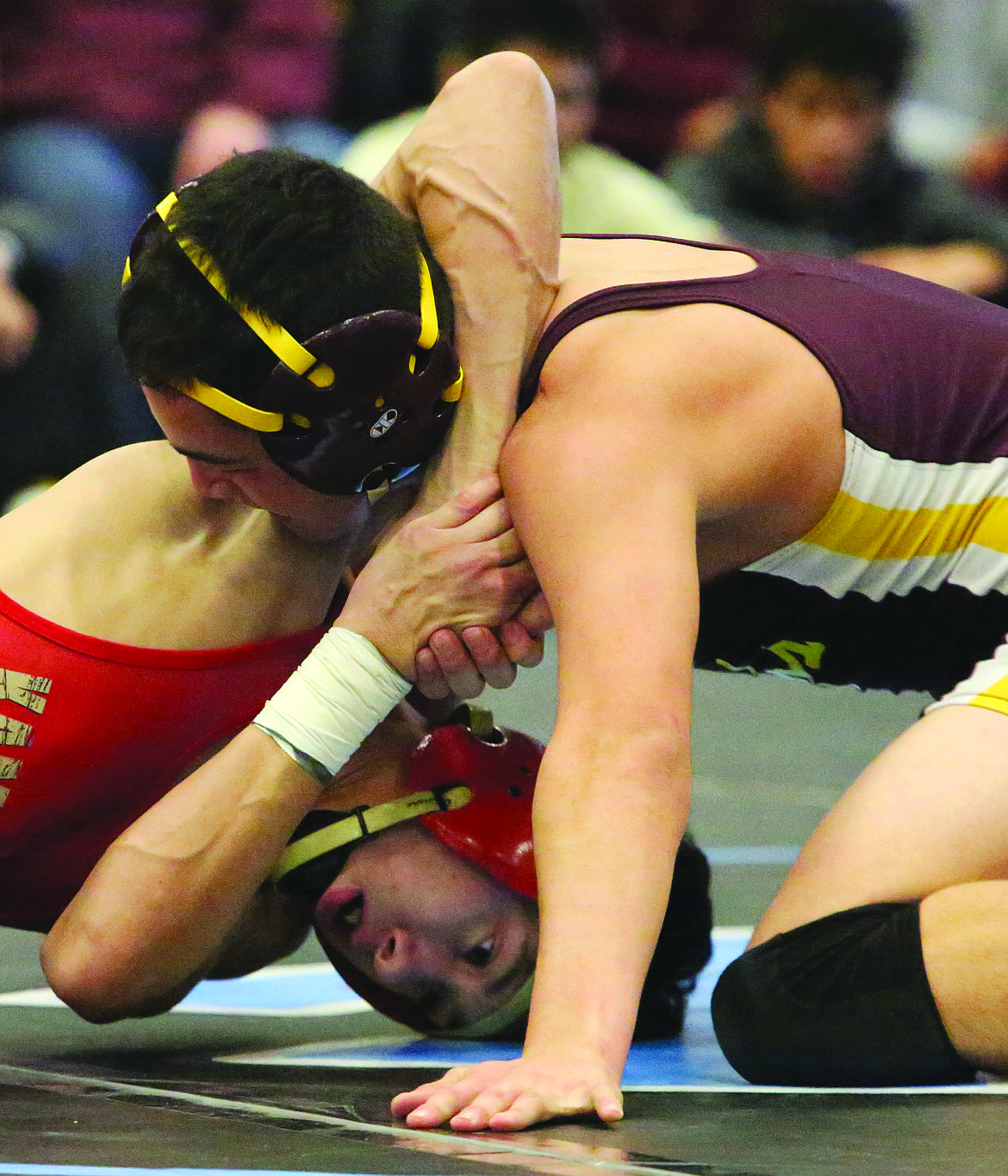 Connor Vanderweyst/Columbia Basin Herald
Moses Lake's Xzavier Villarreal (maroon) tries to free himself from the grasp of Kamiakin's Xavier Zavala.