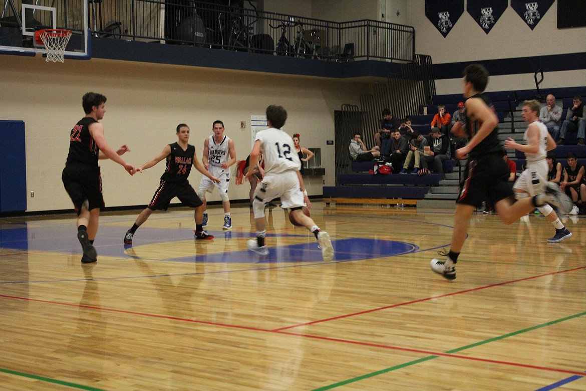 Photo by Tanna Yeoumans
Dylan Hittle works with teammates to score.