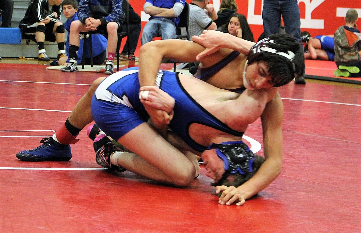 Superior&#146;s Mike Parkin works to pin his opponent during the Bob Kinney Classic in Superior on Saturday, Dec. 9. (Kathleen Woodford photos/Mineral Independent).