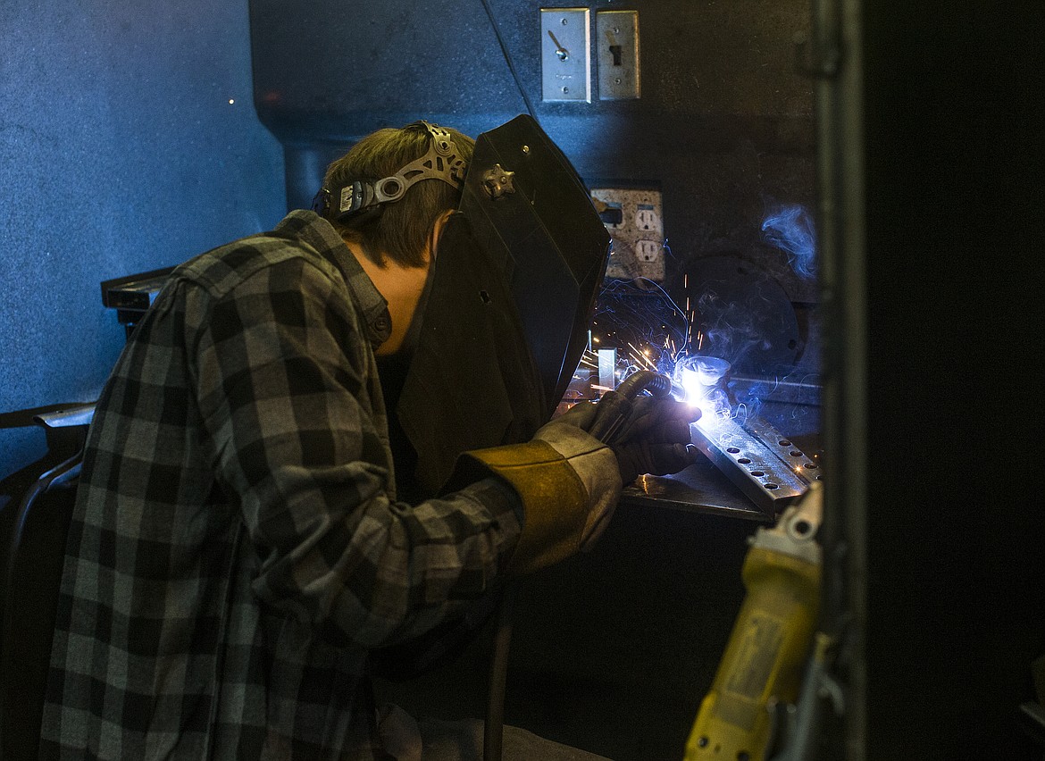 Photos by LOREN BENOIT/NIBJ
Alex Romero welds a part used to hold an emergency light at Ventry in Hauser Lake.