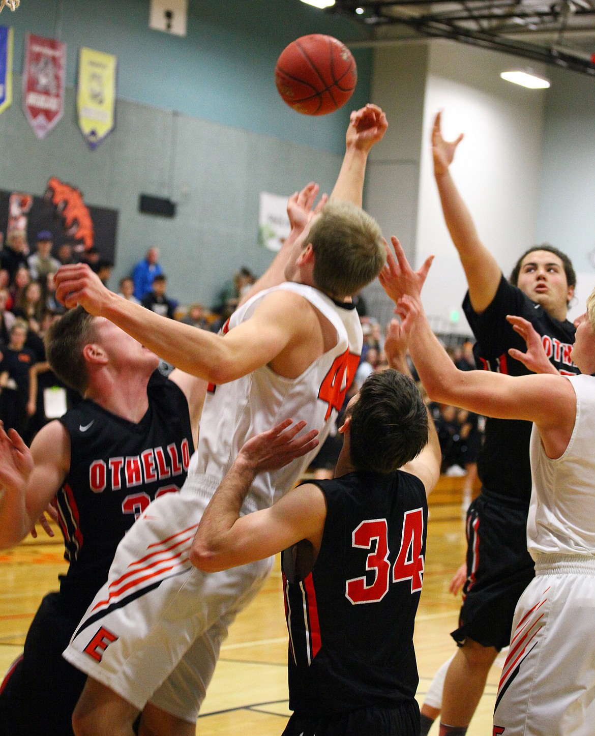 Rodney Harwood/Columbia Basin Herald
Ephrata forward Joshua Benthem (44) goes up for a rebound against Othello's Trevor Hilmes (32) and Julian McDonald (52) during the third quarter of Thursday night's CWAC game in Ephrata.