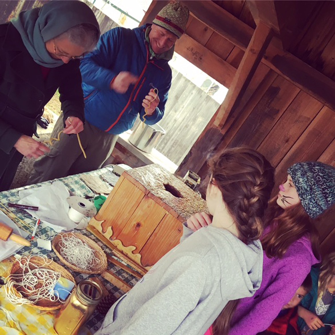 (Photo courtesy KATIE COX)Beeswax candle dipping is a popular station at the Sandpointn Waldorf School's annual Christmas Faire.