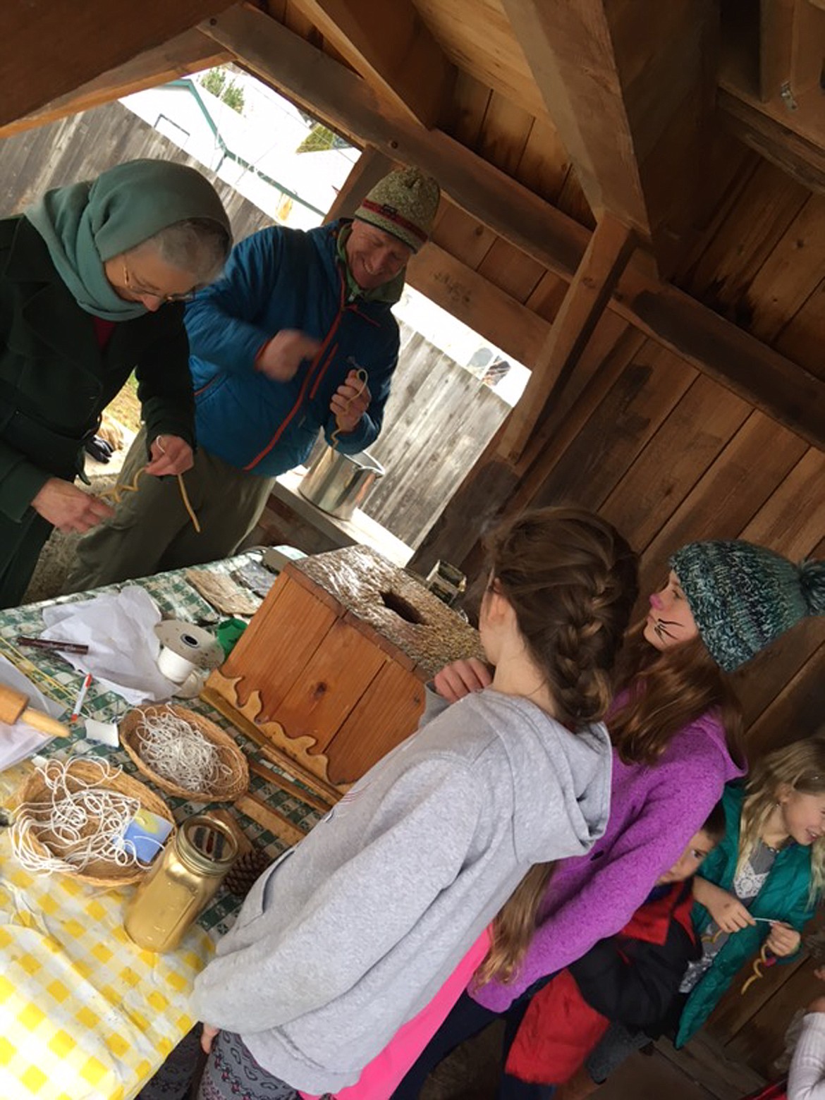 (Photo courtesy KATIE COX)Beeswax candle dipping is a popular station at the Sandpointn Waldorf School's annual Christmas Faire.