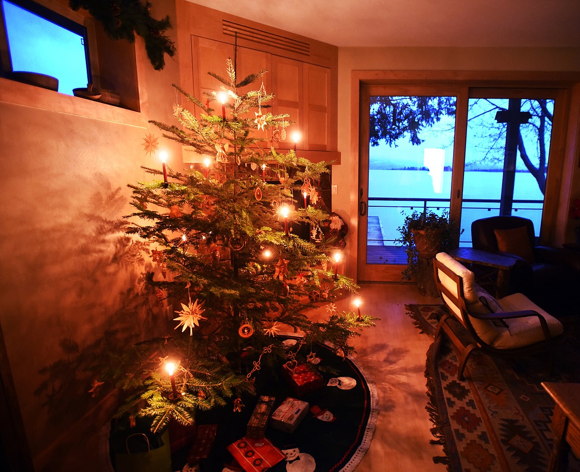 A balsam fir tree glows with genuine candlelight in the home of Elsa Putzier in Bigfork. Putzier hand-selects her trees, looking for flat, strong branches and spread-out limbs to help ensure the tree will not catch fire.
(Brenda Ahearn/Daily Inter Lake)