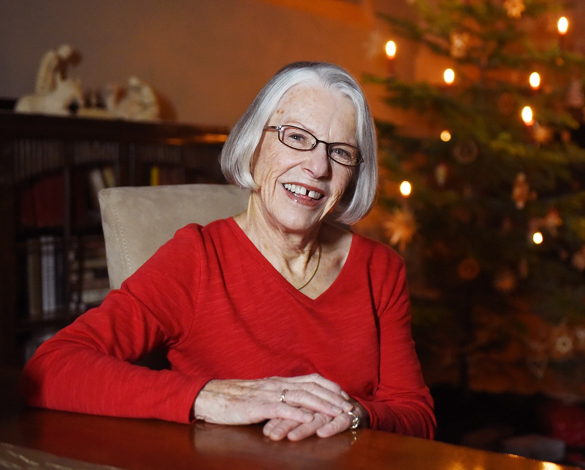 A portrait of Elsa Putzier in her Bigfork home. The creche in the background, left, as well as the candles used on the tree, are from Switzerland.
(Brenda Ahearn/Daily Inter Lake)