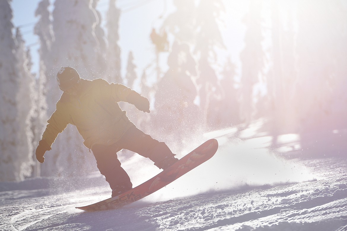 A snowboarder takes a run down the Meadow Trail at Blacktail Mountain Ski Area&#146;s on Saturday.


(Casey Kreider/Daily Inter Lake)