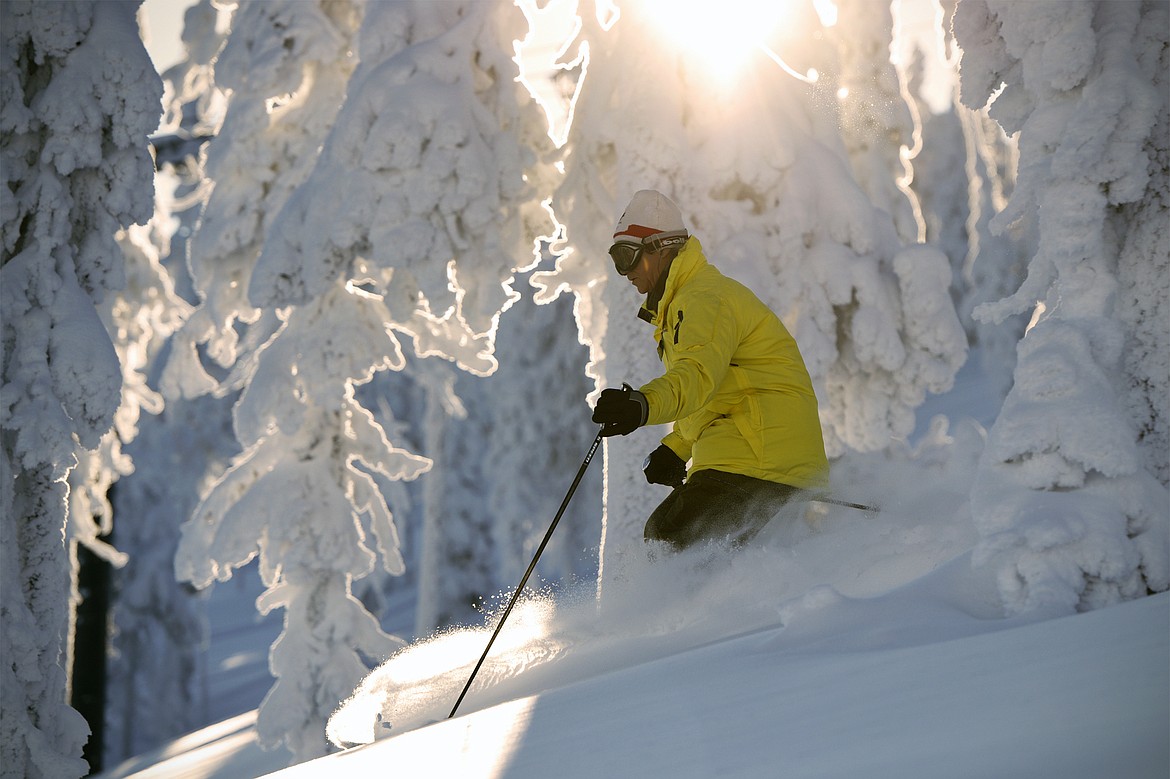 A skier heads past &#147;snow ghosts&#148; on opening day at Blacktail Mountain in Lakeside. 



(Casey Kreider/Daily Inter Lake)