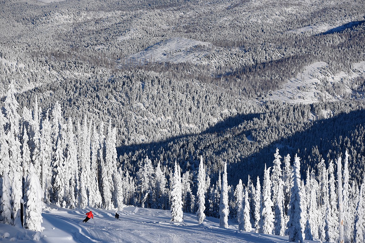 A pair of skiers take a run down the Meadow Trail at Blacktail Mountain Ski Area&#146;s opening day Saturday, Dec. 23. (Casey Kreider/Daily Inter Lake)