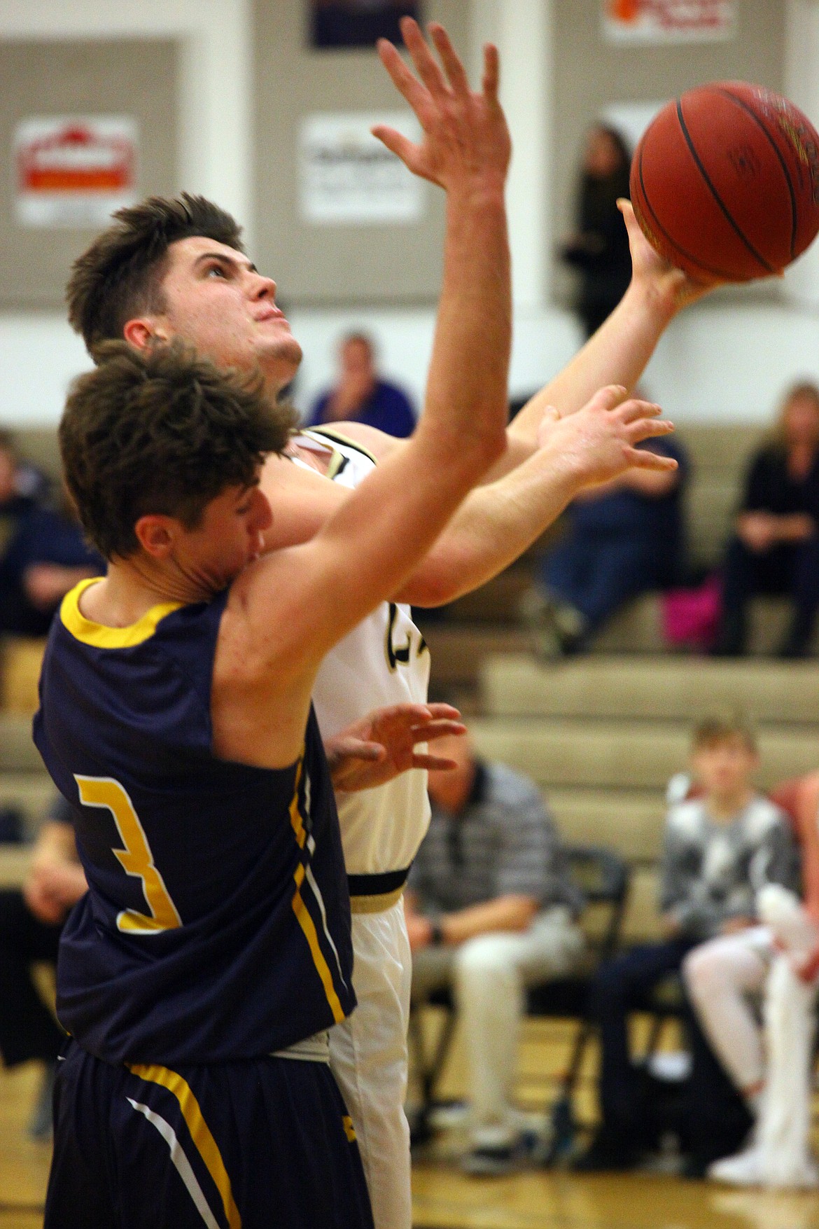 Rodney Harwood/Columbia Basin HeraldRoyal guard Owen Ellis (23) drives the lane against Kobe Kohls (3) of Naches Valley during SCAC action on Friday night.