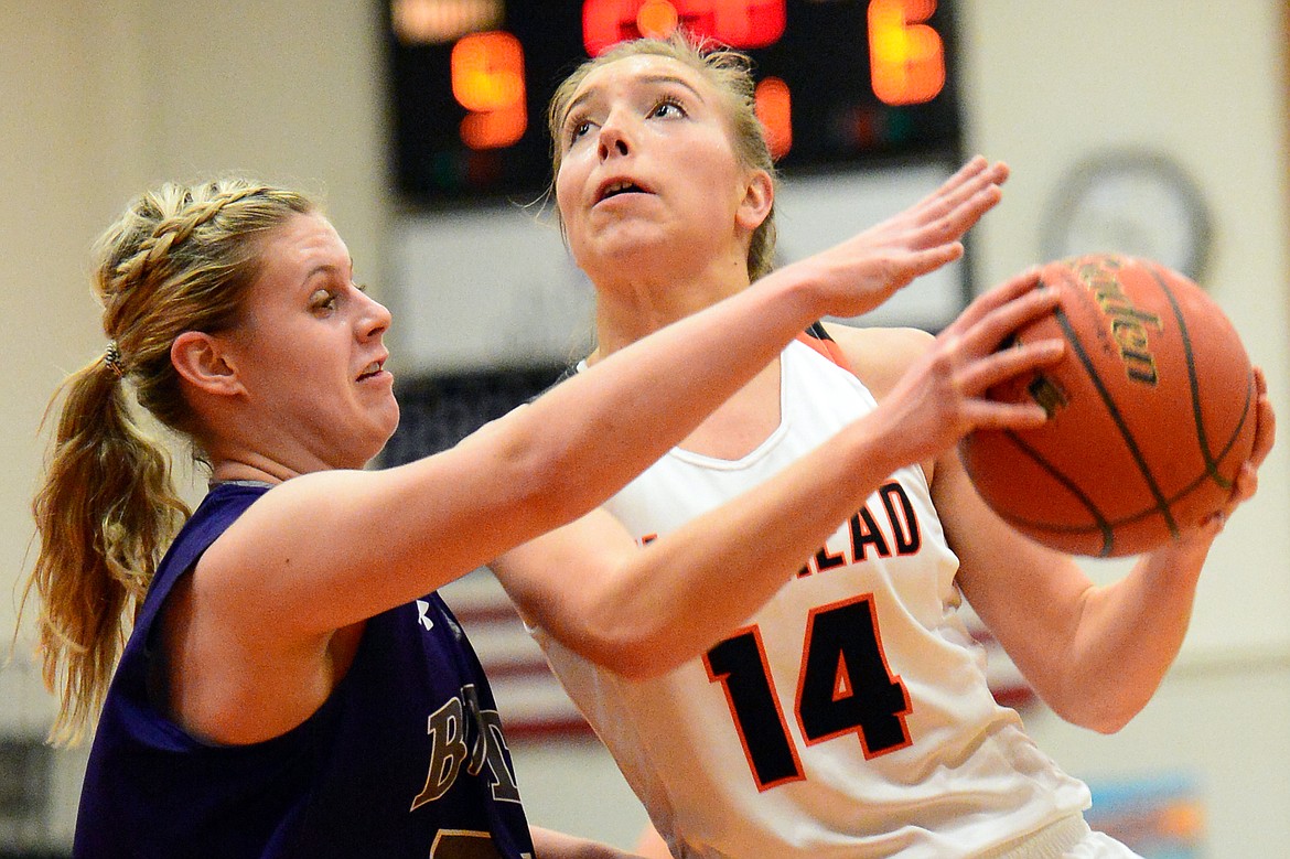 Flathead&#146;s Mary Heaton drives to the hoop with Butte&#146;s Brittany Tierney defending. (Casey Kreider/Daily Inter Lake)