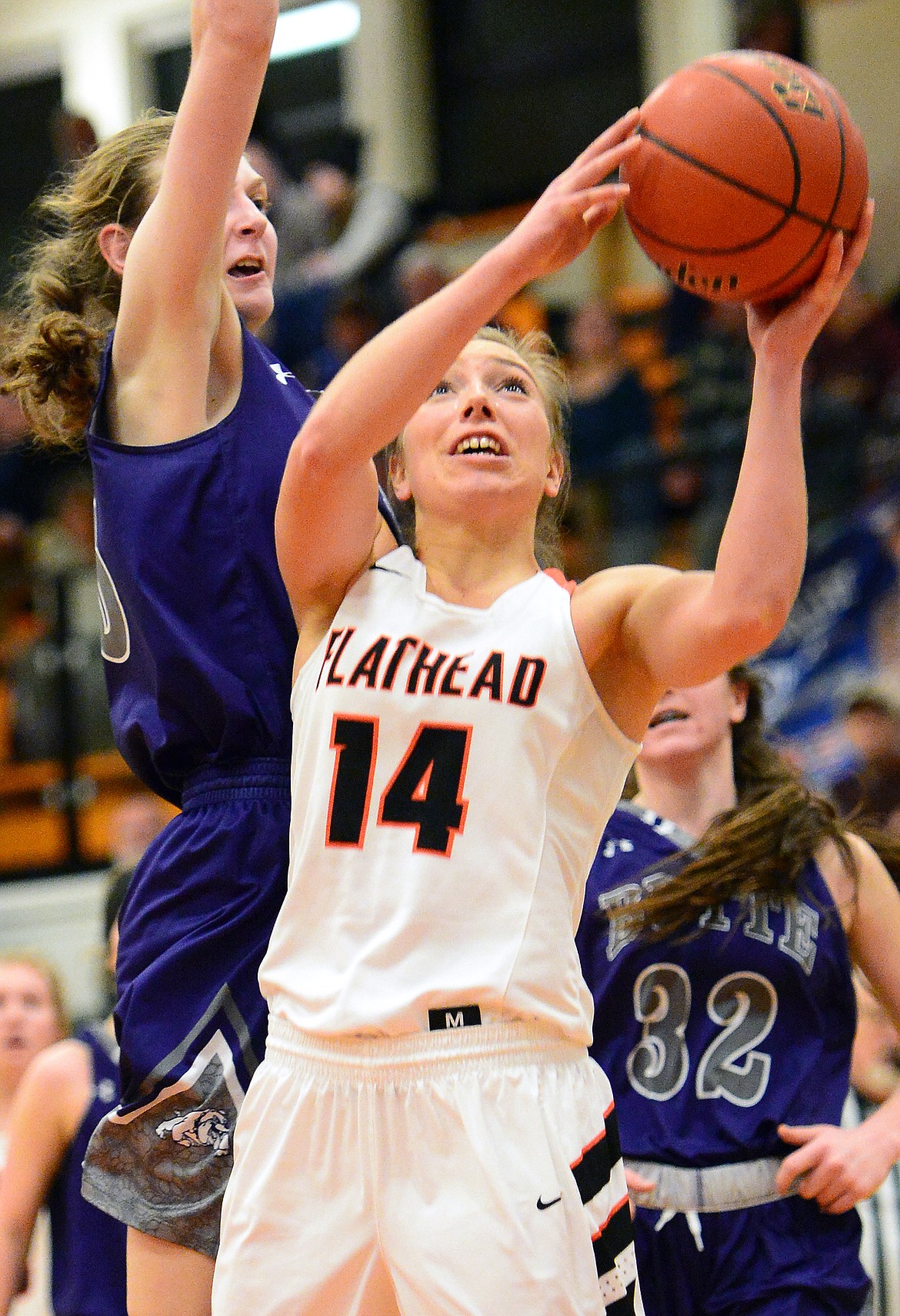 Flathead&#146;s Mary Heaton drives to the hoop with Butte&#146;s Kira Mortensen defending. (Casey Kreider/Daily Inter Lake)