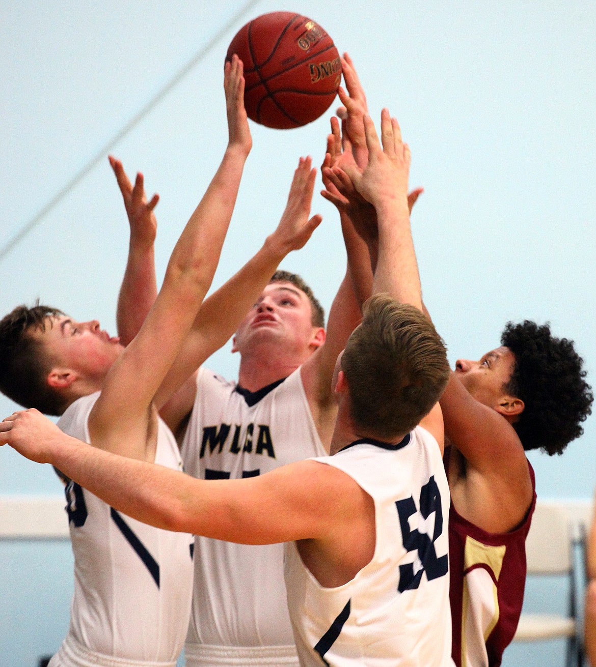 Rodney Harwood/Columbia Basin Herald
Action in the paint got intense during the second half of Thursday night's non-league between Moses Lake Christian and the Moses Lake freshmen team. The Lions beat the Chiefs 54-28.