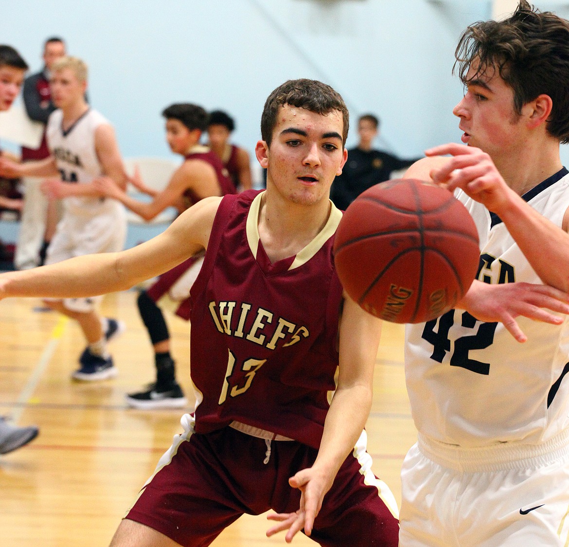 Rodney Harwood/Columbia Basin Herald
 Moses Lake freshmen Luke Regimbal (33) defends against Caedman Waldrop of Moses Lake Christian (42) during Thursday night's non-league game.