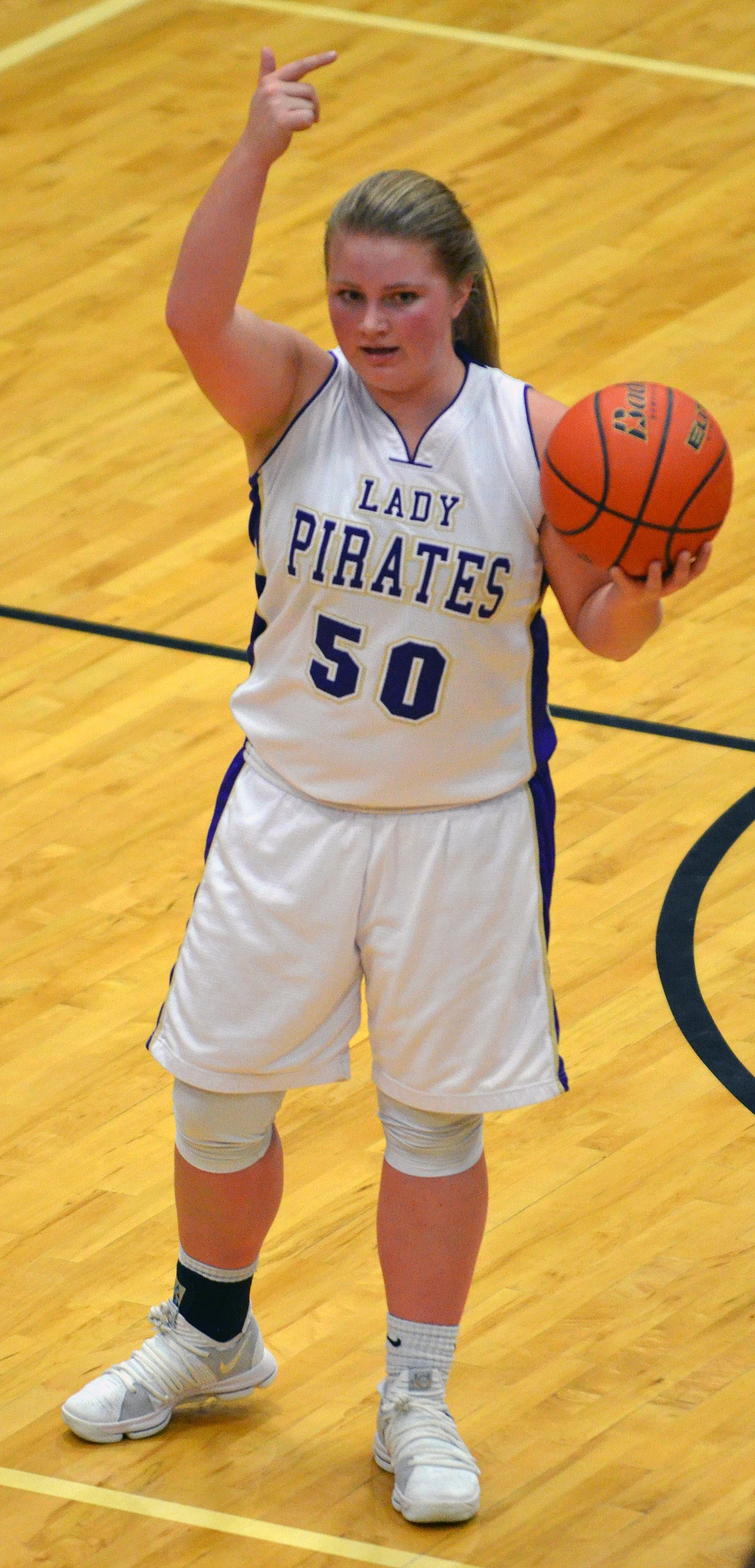 POLSON LADY Pirate gaurd Jaycee Frydelund calls the play in the Dec. 15 game against Whitefish at Linderman Elementary School Gym. (photo by Jason Blasco/Lake County Leader)